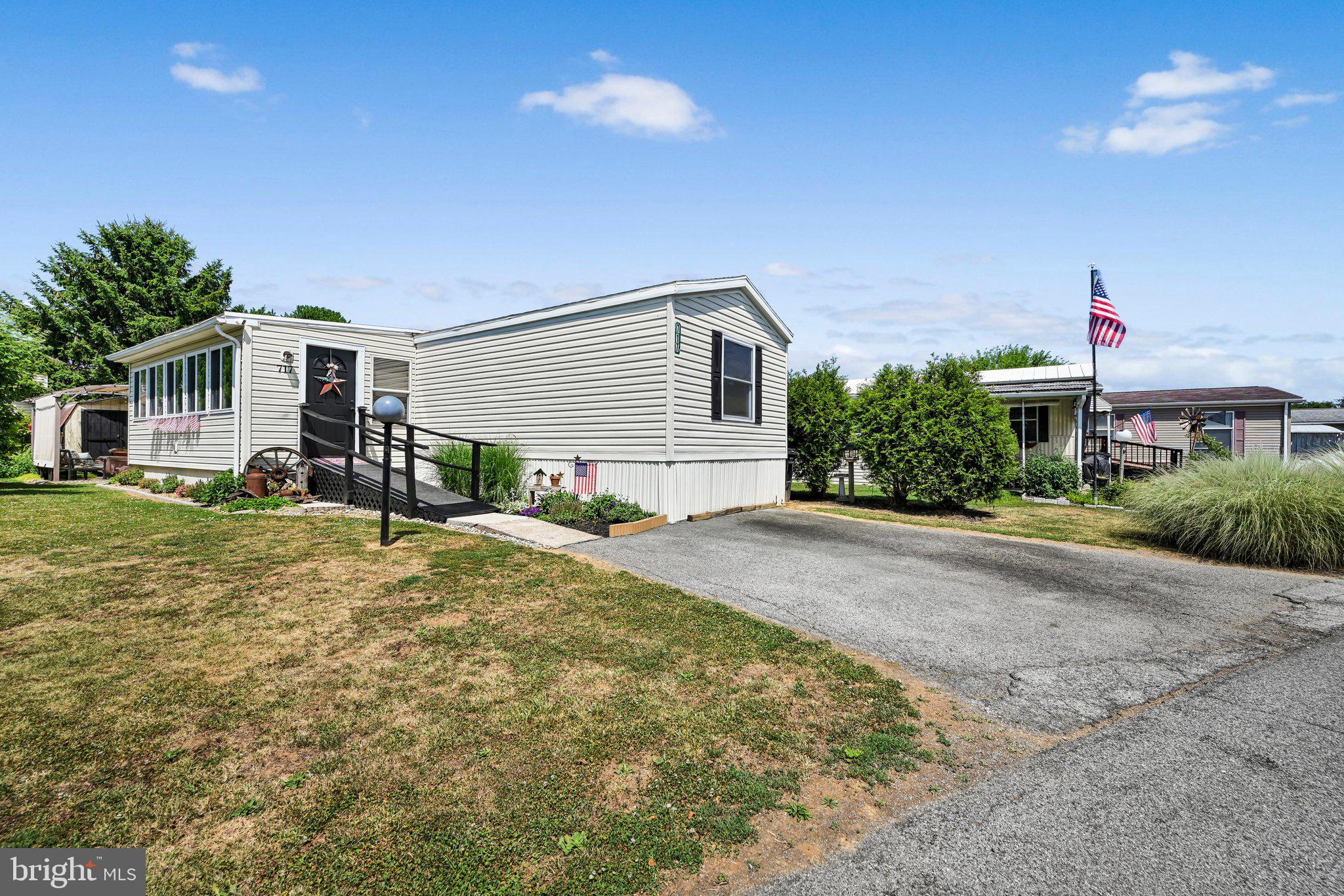 Discover the charm of this beautifully designed 3-bedroom, 2-bathroom manufactured home nestled in the desirable Palm City Park community. Built in 2001, this residence boasts a modular style with vinyl siding, offering both durability and aesthetic appeal. Step inside to find a spacious layout featuring a kitchen island perfect for culinary adventures, and a primary bath that invites relaxation with a soaking tub and tub shower. The interior shines with recessed lighting and cozy carpeting, creating a warm and inviting atmosphere throughout. Enjoy the convenience of off-street parking for two vehicles, ensuring easy access for you and your guests. Beyond the walls of this lovely home, the Palm City Park community offers a wealth of benefits.  The neighborhood is known for its friendly atmosphere and community spirit, making it an ideal place to connect with neighbors and create lasting memories. With essential public services just a stone's throw away, convenience is at your fingertips. This property is not just a house; it's a gateway to a vibrant lifestyle in a welcoming community. Don't miss your chance to make this charming home your own!