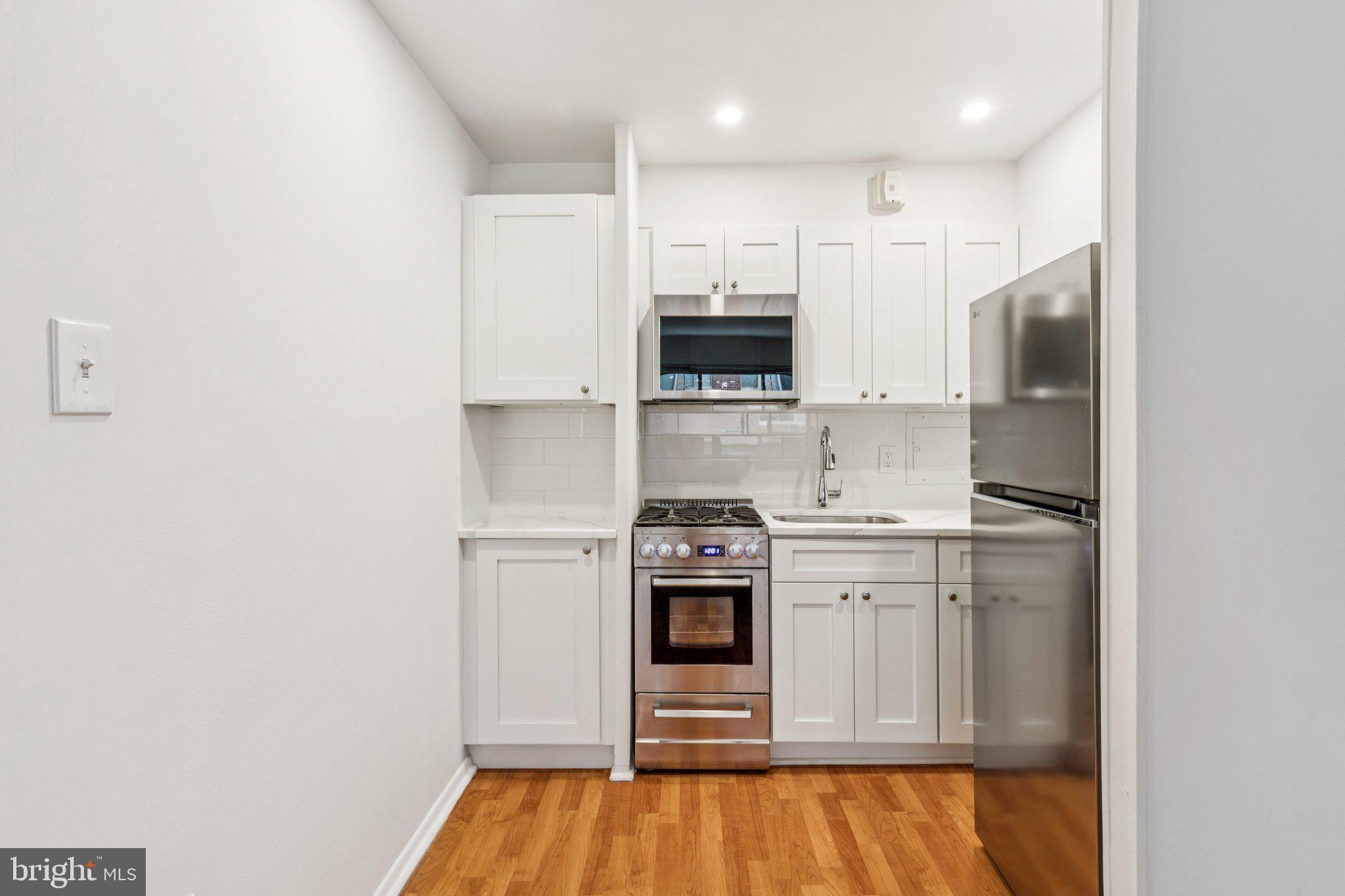 Enjoy convenient city living from this one of a kind home in the center of it all! The living area features hardwood floors and a wall of windows offering unobstructed city views and an abundance of natural light. The kitchen has been completely re-imagined, with a brand new refrigerator, oven, stove top and over-the- range built in microwave. Cabinetry and shelves have been tastefully added throughout to allow for additional storage and a pantry. The bedroom has been freshly carpeted and provides a rarely offered oversized closet. Completing this one of a kind residence is a completely re-tiled bathroom, reglazed tub and brand new vanity with ample storage. Condo fees include ALL UTILITIES (gas, water, and electricity), building insurance, on-site maintenance, a state-of-the-art fitness center, and 24 hour lobby attendant. Onsite parking is also available for an additional monthly fee. Close to restaurants, shopping, theaters and public transportation, this pet-friendly condo at Riverwest is in the center of it all. The campuses of Penn and Drexel, 30th Street Station and major hospitals are all just minutes away.