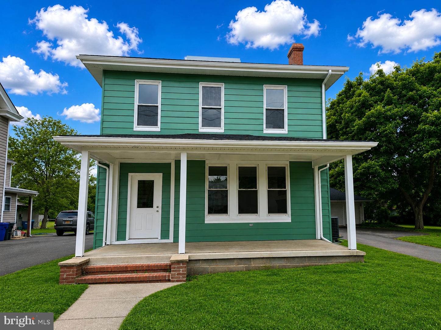 WOW! What a transformation of this sturdy Four Square Colonial nestled in a peaceful small-town setting. Enjoy the convenience of being within walking distance to parks, schools, the post office, and local markets while still having the space and privacy of an oversized nearly half-acre lot.

The exterior features a detached oversized two-car garage with pull-through access to the HUGE backyard — perfect for entertaining, gardening, or future outdoor projects. A brand-new roof has just been installed on both the home and garage, adding even more value and peace of mind.

Inside, the home has undergone a complete top-to-bottom renovation while maintaining the charm and solid craftsmanship of a bygone era. The stunning new interior includes an open-concept main level, all-new kitchen and baths, updated flooring, fresh drywall, neutral designer paint throughout, and brand-new appliances. Comfort is covered year-round with newly installed central heating and air conditioning.

The fabulous primary suite offers a true retreat with a custom glass-enclosed shower and beautifully updated finishes. Additional highlights include a full dry basement offering excellent storage.

This home truly offers the best of both worlds — the beauty and convenience of new construction combined with the timeless quality and character of a classic colonial. Put this one at the top of your list to tour soon!