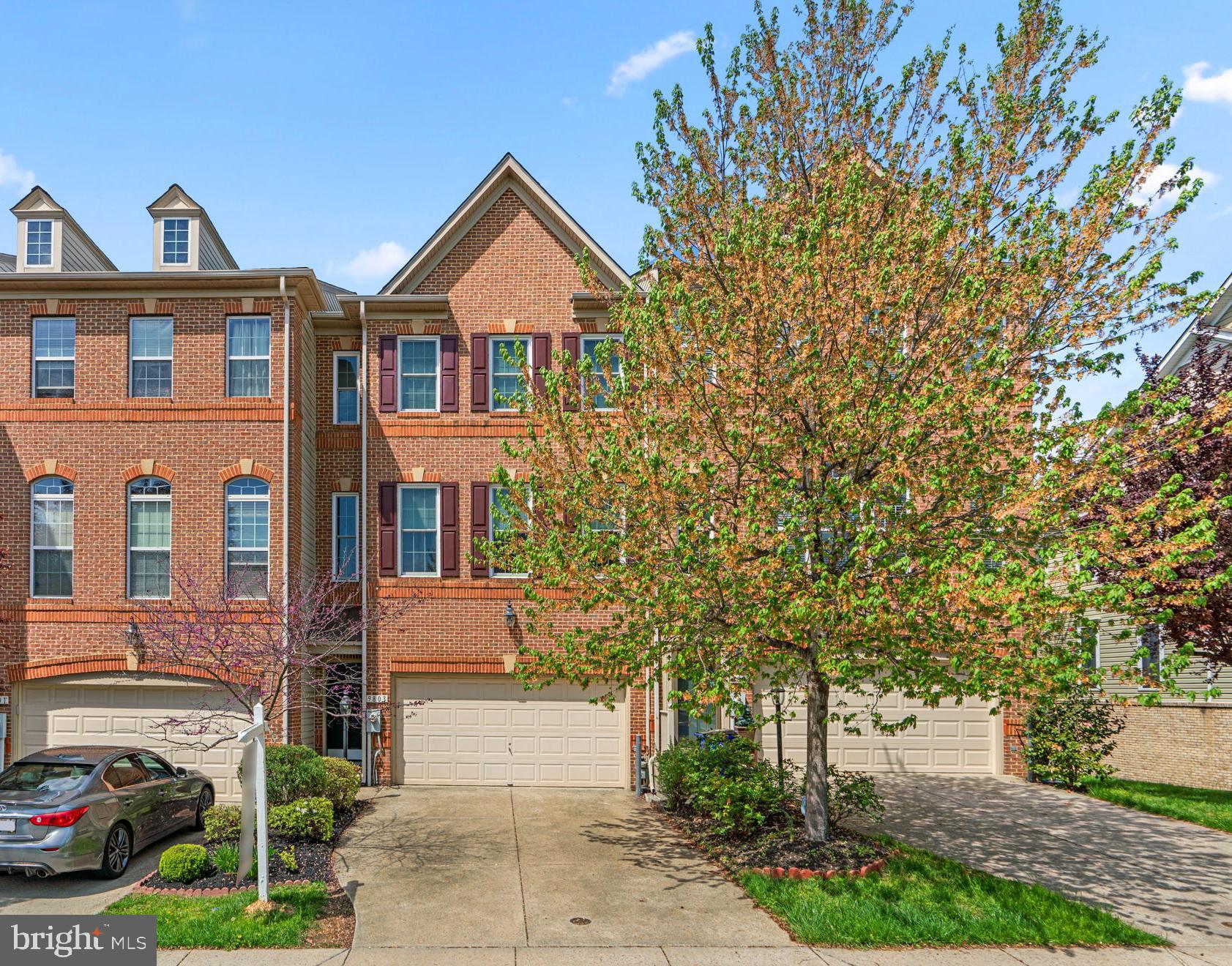 Traditional townhouse residence offering 2,504 square feet with 3 bedrooms, 2 full baths, 2 half baths, and a 2-car garage, available for lease in the desirable Emerson / Cross Creek community. Hardwood floors extend through the foyer and main level, where a spacious, sunlit living and dining area is defined by a modern chandelier and chair railing, seamlessly flowing into the kitchen. The eat-in kitchen is equipped with stainless steel appliances, a center island with a breakfast bar, a chic tile backsplash, a pantry, and generous cabinet and counter space. It opens to a cozy family room with a fireplace and access to a balcony. A powder room completes this level. Upstairs are three carpeted bedrooms and two full bathrooms, including the primary suite with a private balcony, two walk-in closets, and an ensuite bath featuring a large corner soaking tub, dual sinks, and a separate frameless glass shower. The lower level offers a versatile recreation room with hardwood floors, walk-out access to a covered patio, and a convenient laundry area. Residents enjoy access to a community clubhouse, scenic trails, a picnic area, swimming pool, tennis courts, and multiple tot lots and playgrounds.