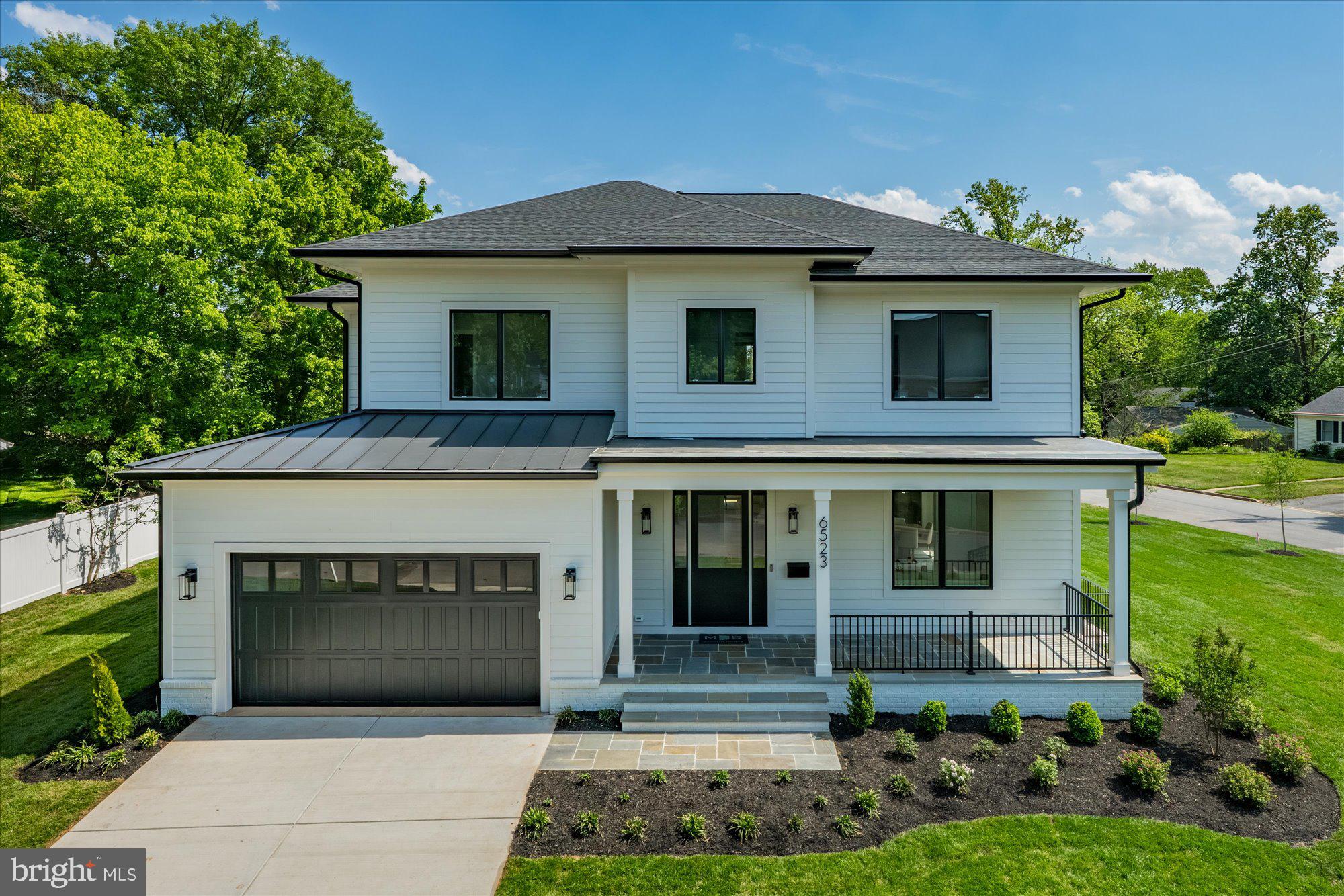 M-R Custom Homes presents this beautiful new custom home on a quiet street in Falls Church. This home features 7 bedrooms, 6 full bathrooms, and one powder room with 6,875 square feet of finished living space on three levels and beautiful seven-inch white oak hardwood floors throughout the main and upper levels. The main level includes 10ft ceilings, and a beautiful gourmet kitchen with custom inset maple cabinetry, 2.5" quartz countertops, 48" paneled Subzero refrigerator, 48" Wolf gas range, two Bosch dishwashers, and a built-in Wolf microwave. The kitchen opens to spacious great room with gas fireplace and flanking built-ins . Through the butler's pantry is an elegant formal dining room with abundant natural light. A large screened porch with heaters and speakers provides an amazing outdoor living space overlooking the backyard. A formal living room, en-suite bedroom/study, and a mud room with built-ins complete the main level living spaces. The upper level is highlighted by a luxurious primary suite with dual walk-in closets with built-ins, and a spa-like bathroom with heated floors, double vanities, stand-alone soaking tub, and heavy glass enclosed shower. The walk-up lower level includes a spacious recreation room with a wet bar, an exercise room, a bedroom with full bathroom, and a flex space. The 14,976 square foot lot is professionally landscaped with outdoor lighting and includes an irrigation system. This home has a built-in elevator shaft for optional conversion. Convenient to downtown Falls Church, Tysons, McLean, and much more.