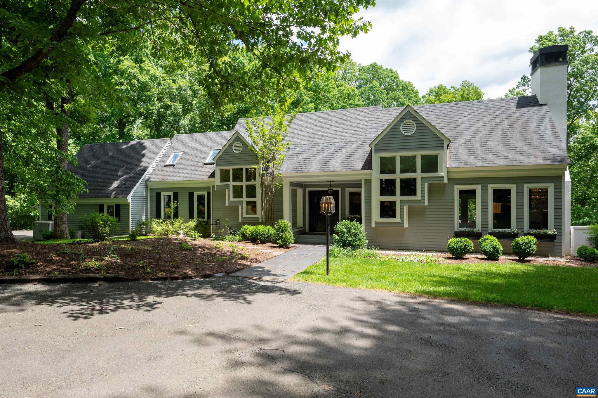 .NEW IMPROVED PRICE   Architect designed contemporary  with natural light filled rooms opening to wonderful outdoor living spaces on a cul-de-sac in the quiet Ivy Neighborhood of Spring Hill. This beautiful home features a first floor master suite with a spa bathroom, three additional bedrooms and baths, plus a private study or home office with a full bath, formal living room with fireplace and dining room. The blue and white chef's kitchen has a Viking gas range, Viking refrigerator, new Bosch dishwasher, KitchenAid wall oven, granite counters, and opens to the spacious family room with stone fireplace, wet bar and stairway to second floor open loft. Double doors and abundant windows invite you out to terraces and lovely pool and pool deck. Perfect for entertaining. There is a fully conditioned two car garage off the kitchen. A terrace level guest or au pair efficiency quarters and recreation room complete the residence. The landscaped grounds offer mature plantings, an open yard, acres of woods and a creek to explore all in a magical private setting in the Heart of Ivy. Minutes to UVA and everything Charlottesville has to offer. Western schools.,Glass Front Cabinets,Granite Counter,Painted Cabinets,Fireplace in Family Room,Fireplace in Living Room