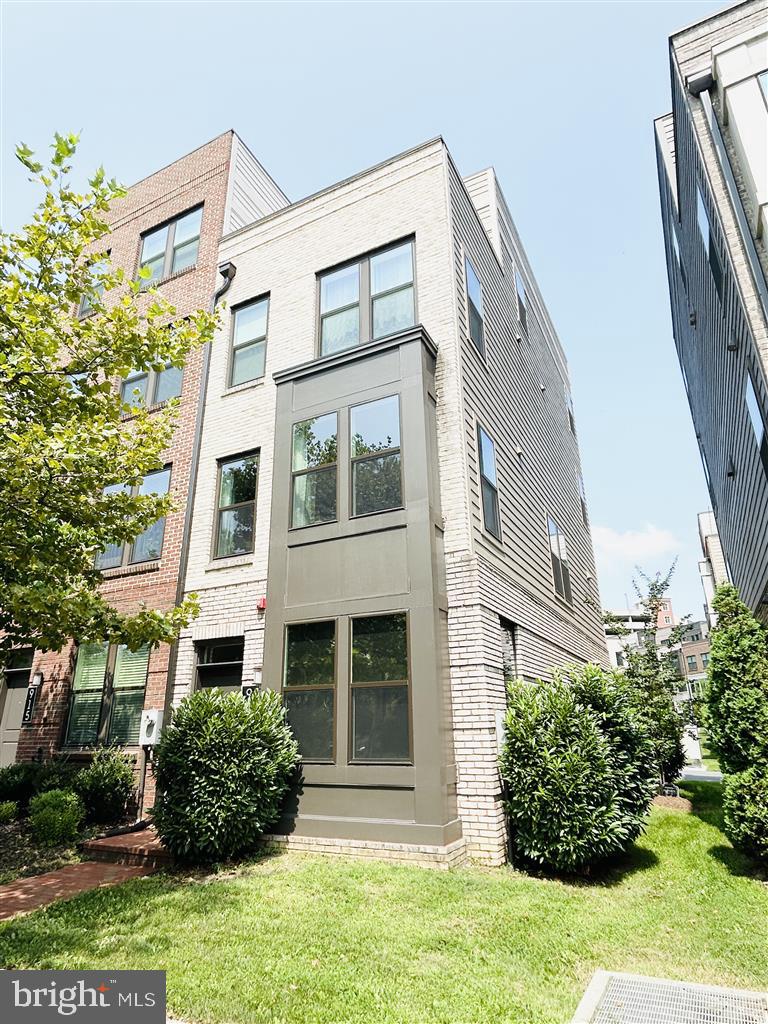 Modern End-Unit 4-Level Townhome with Rooftop Terrace in King Farm! Welcome to 913 King Farm Blvd — a like-new, luxurious end-unit townhome, offering light-filled living space and unobstructed tree views. New construction townhome purchased in 2020 and barely lived in. This elegant residence features 3 bedrooms, 3.5 baths, and a spacious loft, perfect for a family room and home office, along with a private rooftop terrace with stunning views. The open-concept main level boasts a gourmet kitchen with upgraded KitchenAid appliances, quartz countertops, hardwood floors, and abundant natural light on three sides. Additional highlights include a 2-car tandem garage with a full-size driveway (driveway fits a standard SUV), and a low $141 HOA fee. Enjoy access to two large community pools, parks, tennis/paddle ball courts, dog park, nature trails, restaurants, shops, and a free shuttle to the nearby Shady Grove Metro. With easy access to DC and Northern VA, this move-in ready home combines modern convenience, comfort, and location in one of Rockville’s most desirable neighborhoods! Can also be sold partially furnished (negotiable) for added convenience.