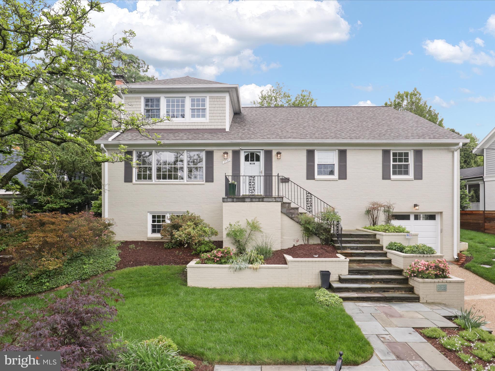 Beautifully expanded and meticulously maintained 4BR/3BA home in sought-after Country Club Manor. Nestled on a quiet, tree-lined street, this home blends timeless charm with thoughtful modern updates across three spacious levels. Main level features white oak floors, an oversized living room with brick fireplace, formal dining room, and updated kitchen with custom cherry oak cabinetry, granite counters and stainless steel appliances—plus access to an expansive rear deck.

The upper-level addition boasts a luxurious primary suite with tray ceilings, spa-like bath, and a private balcony overlooking the professionally landscaped yard. A Deluxe Office/Studio/Bedroom completes the upper level. Lower level offers a rec room with wood-burning fireplace, full bath, ample storage, and access to an oversized one-car garage with a level 2 EV charger.

Major updates include new roof, HVAC, furnace, and water heater (2024). Minutes from the GW Parkway and Chain Bridge! A rare find in one of North Arlington’s most desirable neighborhoods!