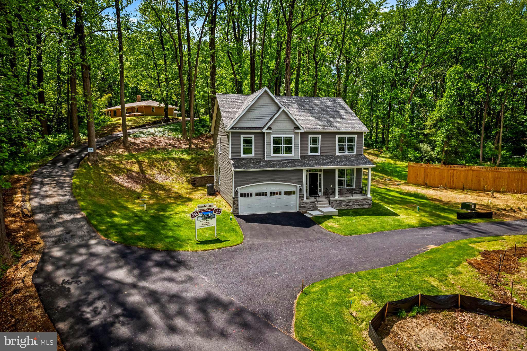 NEW CONSTRUCTION.!!!  SEVERNA PARK SCHOOLS!!!     6.7 Miles to Route 50,  1 .15 Acre+ wooded lot!!! 5 Bedrooms 3.5 Baths.    9-Foot Ceilings on 1st Floor.    Beautiful Custom Kitchen with Quartz Countertops,  Stone Backsplash,  42" Cabinets, Stainless Farm Sink.  Large Custom Tiled Primary Bath Shower with Custom Glass Enclosure!!  City Water,  2 Car Garage.   Double Pane Insulated Windows.  Zoned Trane HVAC Equipment!!   Fire Suppression System.    2nd Floor Laundry Room complete with washer and dryer!! Direct Private Access to the B&A Trail!!!.  Seller to give $5.000 towards fencing.