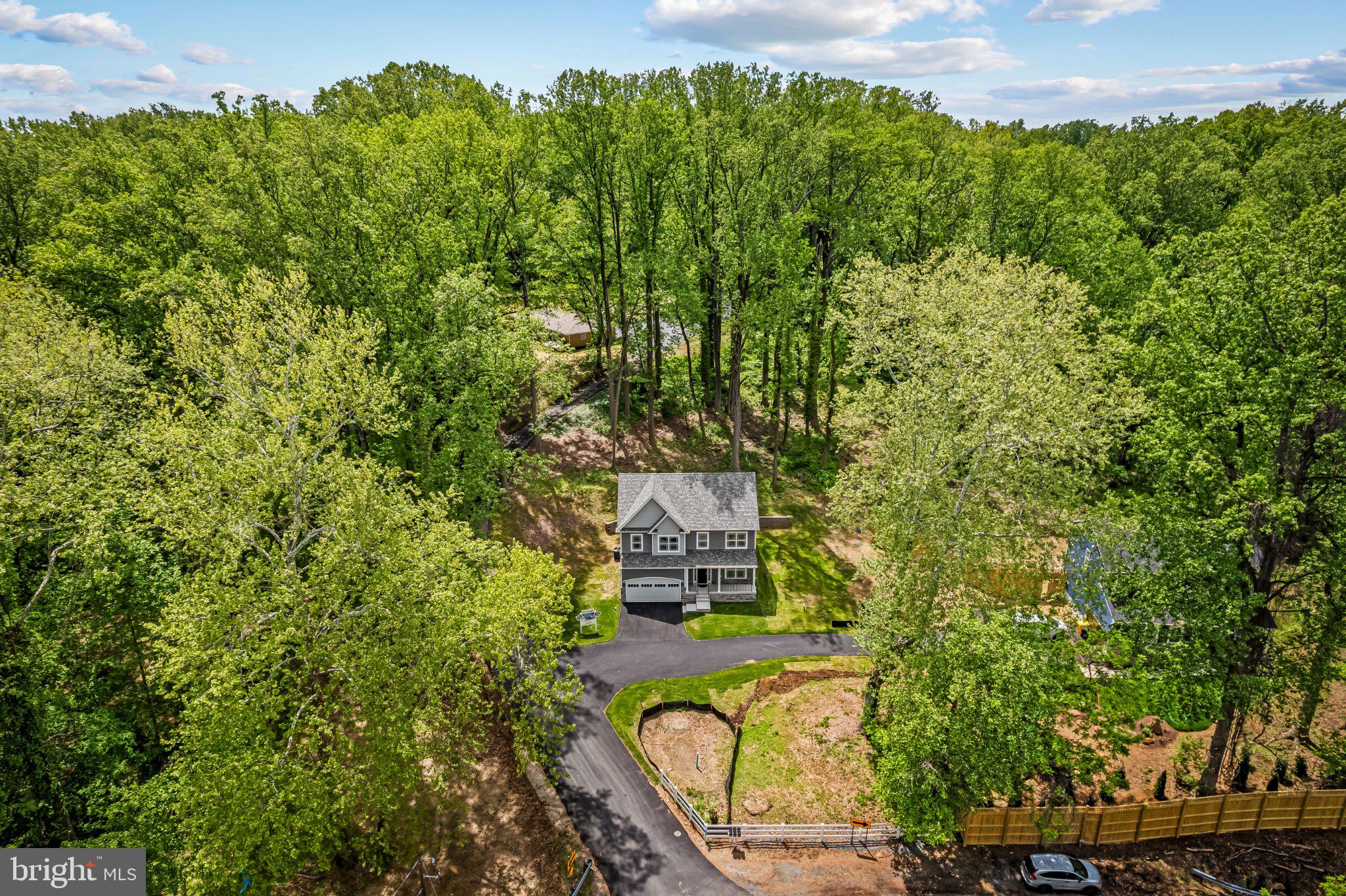 NEW CONSTRUCTION.!!!  SEVERNA PARK SCHOOLS!!!     6.7 Miles to Route 50,  1 .15 Acre+ wooded lot!!! 5 Bedrooms 3.5 Baths.    9-Foot Ceilings on 1st Floor.    Beautiful Custom Kitchen with Quartz Countertops,  Stone Backsplash,  42" Cabinets, Stainless Farm Sink.  Large Custom Tiled Primary Bath Shower with Custom Glass Enclosure!!  City Water,  2 Car Garage.   Double Pane Insulated Windows.  Zoned Trane HVAC Equipment!!   Fire Suppression System.    2nd Floor Laundry Room complete with washer and dryer!! Direct Private Access to the B&A Trail!!!.