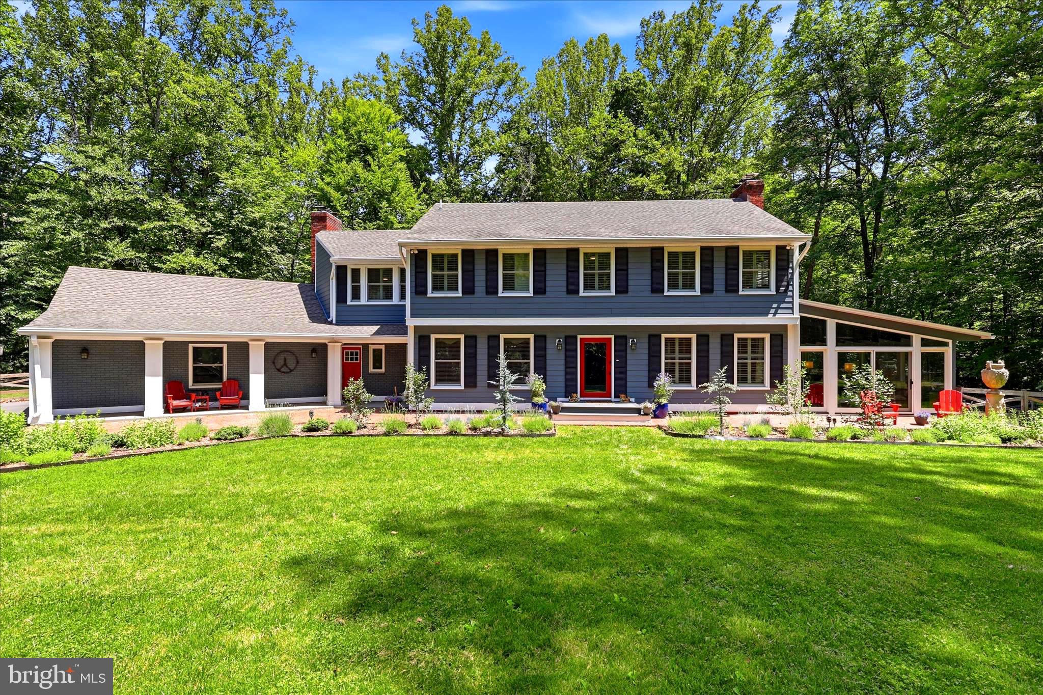 Welcome to this exceptional 5-bedroom Clifton estate, a stunning modern farmhouse where nature, privacy, and thoughtful design come together on a beautifully landscaped property just minutes from historic Clifton, Virginia. This home offers the perfect blend of peaceful country living and convenient access to downtown DC. 
The 5.5 acre lot.. is surrounded by mature trees, abundant wildlife, and frequent visits from all kinds of birds,
 A charming brick walkway leads to a private front door featuring UV-protected glass, setting the tone for the quality and care found throughout the property.
Inside, natural light pours through expansive windows, including a stunning bay window overlooking the lush, flat backyard. The open-concept floor plan creates seamless flow between the living, dining, and kitchen spaces, making the home ideal for both everyday living and entertaining. 
The inviting family room features a wood-burning fireplace, while the four-season room serves as a comfortable year-round den with panoramic views of the surrounding landscape.
The gourmet kitchen is designed for serious cooks and casual gatherings alike, featuring premium KitchenAid stainless steel appliances, a professional-grade six-burner range, pot filler, tile backsplash, reverse osmosis water system, open shelving, and generous workspaces. Thoughtful details such as modern lighting, track lighting, and abundant natural light enhance the home's warm yet sophisticated feel.
The main-level study offers custom built-in cabinetry with integrated lighting and a wine rack, creating a functional and sophisticated work-from-home environment. A convenient powder room completes the main level.
With five bedrooms and three-and-a-half baths across three finished levels, the home offers exceptional flexibility for today's lifestyles.
The upper level features four spacious bedrooms, including an oversized primary suite that serves as a private retreat. The primary bedroom offers a generous sitting area, custom walk-in closet with built-ins, and a beautifully updated spa-inspired bathroom with double vanities, a large soaking tub, and an upgraded shower. Three additional oversized bedrooms provide ample space for family, guests, or flexible living arrangements.
The finished lower level expands the home's versatility with a private fifth bedroom featuring its own full en suite bathroom—ideal for guests, an au pair suite, multi-generational living, or extended stays. This level also offers additional living and entertaining space while maintaining privacy and comfort.
Outdoor living is exceptional, with a full-length rear deck overlooking the fenced backyard, complete with a gazebo-covered outdoor kitchen area. Multiple gathering spaces include two separate fire pits—one in the backyard and another in the corral area—creating the perfect setting for entertaining under the stars. The fenced rear yard is perfect for pets, play, gardening, or simply enjoying the peaceful surroundings.
Additional features include extensive storage, an oversized attached garage with workshop space, and custom shelving and cabinetry in both the garage and workshop that convey. The striking stainless steel sculpture in the front yard also convey, adding character and functionality to the home.
Perfectly located near the Town of Clifton, residents enjoy easy access to Paradise Springs Winery, Hemlock Overlook Regional Park, Bull Run Regional Park, Trummer's Restaurant, Villagio, and Clifton's beloved French bakery and more. This home is close to all the major commuter routes and the Burke VRE. 
Oooh, la, la..