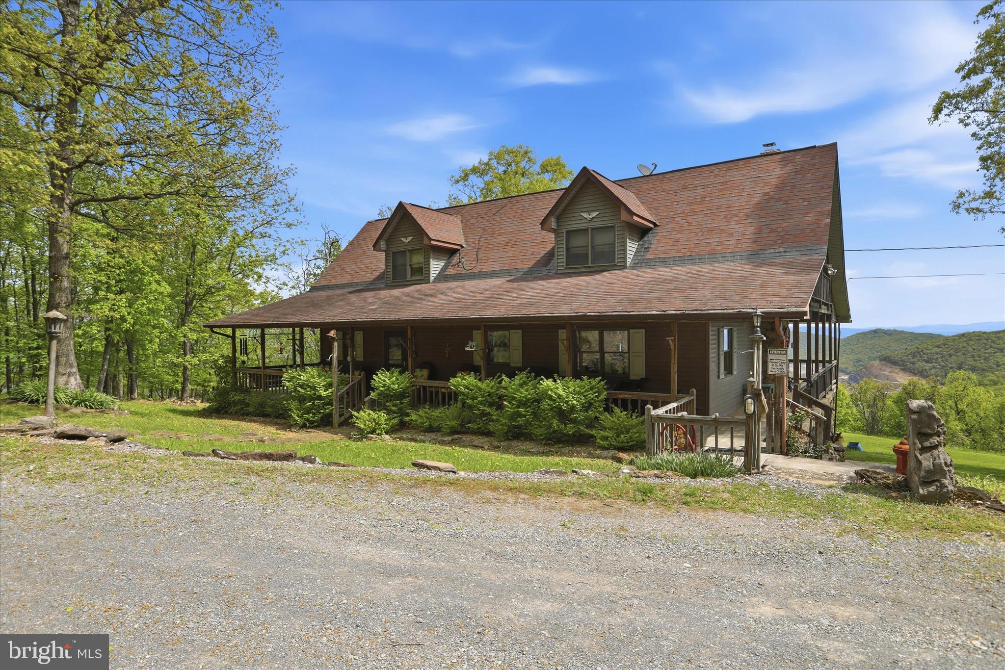 Coming Soon - Some properties have a view. This one has a front-row seat. Set high above the valley on 21.78 acres, this 2,156 sq. ft. mountain home delivers the kind of setting that immediately separates it from the pack. Big sky, rolling ridgelines, mature hardwoods, privacy, and a view that feels like it goes on forever. This is not another ordinary home with acreage. This is a true overlook property with presence. The home has the right mountain feel from the moment you step inside. The main living area is anchored by a massive stone fireplace and finished with vaulted wood ceilings, hardwood floors, and an open layout that brings the living room, dining area, and kitchen together in one comfortable gathering space. With 3 bedrooms, 2.5 bathrooms, and a spacious upper loft, the floor plan offers plenty of room for full-time living, weekend use, family, guests, or a quiet retreat from everything below. The covered porch space is a major part of the lifestyle here. Morning coffee, evening sunsets, long-range views, cool mountain air, and total privacy are all part of the package. The land gives you nearly 22 acres of wooded mountain ground to enjoy, explore, and control, without feeling isolated from the real world. The detached garage is not an afterthought. At approximately 1,500 sq. ft., it provides serious space for vehicles, equipment, tools, ATVs, side-by-sides, a workshop, or storage for everything that comes with owning a rural property. That kind of garage space dramatically expands the usefulness of the property. The location ties it all together. You get the feel of a private mountain retreat while remaining very close to ABL/ATK and only minutes from LaVale and Cumberland, Maryland. Shopping, restaurants, employment, medical services, and everyday conveniences are all within easy reach. This property has altitude, acreage, character, utility, and access. It is part home, part retreat, part mountain escape, and part practical rural setup. For the buyer who wants the view, the garage, the land, and the convenience, this one checks boxes most properties never touch.