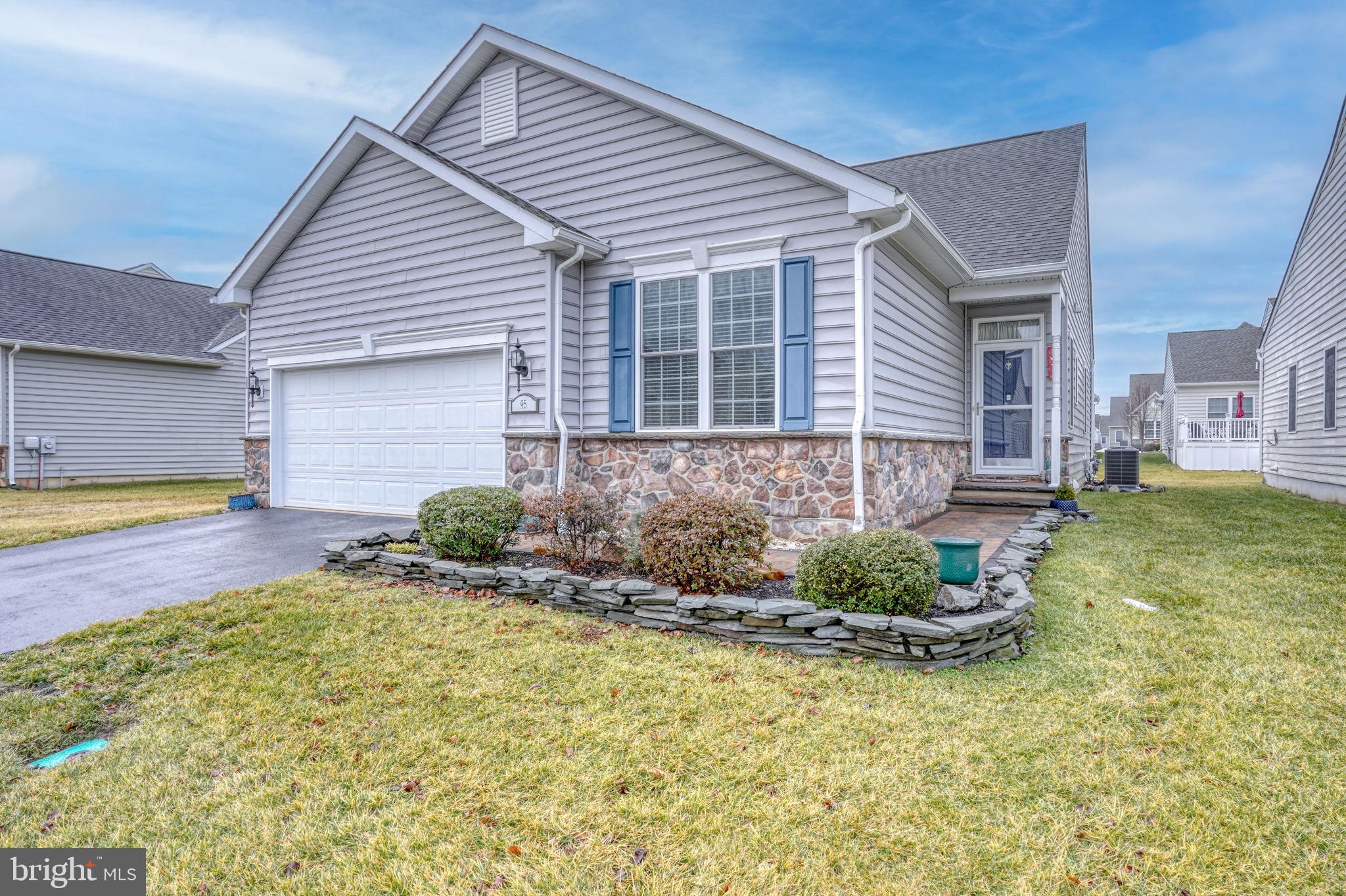 Welcome to the Village of Eastridge in Smyrna, Delaware where convenience and low maintenance living are key. Priced to sell and loaded with updates, 95 Oscar Mill Lane has been exceptionally maintained with upgrades around every corner. The paver walkway brings you to the entrance of the home which features a custom tile floor that then leads to beautiful hardwood floors throughout the living area and both bedrooms. The kitchen is bright and open with an expansive island for all of your meal prep. Granite counters, gas cooking, ceramic tile floors, new lighting and updated appliances finish this beautiful space. The large living room opens up to a sunroom where you can enjoy a good book and your morning cup of coffee. The primary bedroom offers a relaxing area with a large walk in closet and an attached full bathroom. This is the perfect space to retreat and unwind. Both bathrooms have been updated with upgraded vanity tops, new fixtures, lighting and mirrors and even feature new tile surrounds in the showers. The outdoor space features a low maintenance deck with plenty of space for outdoor dining, your favorite plants and a grill. To top it off, this property has an inground irrigation system which makes maintaining this lawn even easier! Village of Eastridge offers easy living where the lawns and snow removal are not your concern. Located just minutes from Dupont Highway, this area offers easy access to shopping, recreation and all of your travel needs!
