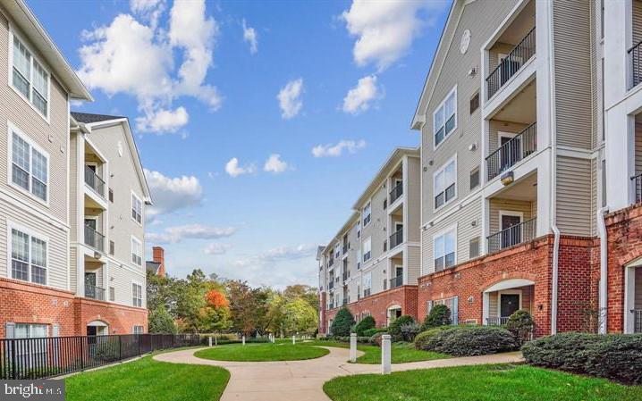 Situated in a convenient, walk-to-metro community, you won’t want to miss this top-floor Adams model condo in the amenity-packed Exchange at Van Dorn. Offering two spacious bedrooms, and a well-designed layout with open yet distinct living areas, inside you will find a separate, tiled entry foyer and hardwood floors throughout. The spacious kitchen features stainless steel appliances, gas cooking, ample cabinets, a pantry, and great counter space. The living room, complete with a cozy gas fireplace, opens to a covered balcony, perfect for morning coffee or unwinding at the end of the day! Both bedrooms receive abundant natural light, and the large bathroom has a linen closet and an extended vanity. Highlights include a brand-new, full-size in-unit washer and dryer, crown molding, wood blinds, and an assigned covered parking space. This commuter-friendly location is just minutes from 495, 395, Reagan National Airport, the Pentagon, and National Landing plus great shopping and dining options in nearby Old Town Alexandria. Community amenities include a fitness center, outdoor pool, playground, fenced dog park, indoor basketball court, billiard room, clubhouse, and visitor parking, plus a FREE shuttle to the Van Dorn (Blue Line) and Eisenhower (Yellow Line) Metro stations, welcome home!