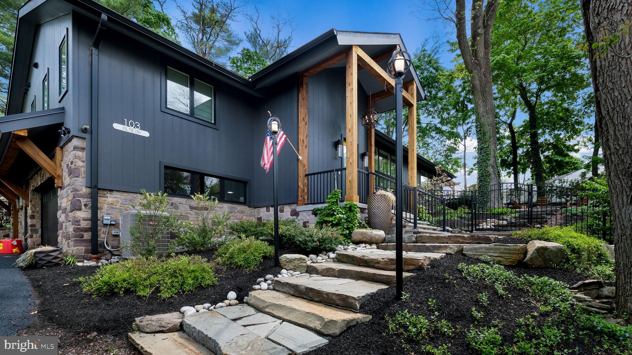 This exceptional, fully renovated luxury residence offers the perfect blend of modern design, refined craftsmanship, and an unbeatable location - just a short walk to the vibrant shops, dining, and culture of downtown New Hope, Lambertville, and the scenic Delaware River.
From the moment you arrive, the home’s professionally landscaped, terraced, and fully fenced grounds set the tone for privacy and sophisticated outdoor living. Designed with both relaxation and entertaining in mind, the exterior features a bluestone patio with a pergola, gas fire pit, hot tub, and beautifully curated green space.
Inside, a dramatic foyer welcomes you with marble tile flooring, exposed stone accents, and striking designer lighting. Throughout the home, white oak flooring, vaulted ceilings, and expansive windows flood the space with natural light, creating an airy and elegant atmosphere. The open-concept living and dining areas are anchored by a stunning floor-to-ceiling gas fireplace with custom built-ins, while iron and glass architectural details, electric window shades, and integrated media enhance both style and convenience.
The gourmet kitchen is a true centerpiece, outfitted with a premium appliance package including a 5-burner gas cooktop with a hood, wall oven, steam oven, dishwasher, and wine refrigeration. An oversized quartz island provides ample space for gathering and prep, complemented by custom cabinetry, a pantry, built-in coffee bar, herringbone tile backsplash, stainless steel farmhouse sink, and charming banquette seating.
The primary suite is a private retreat, accessed through a custom designer barn door and featuring vaulted ceilings, abundant natural light, and direct access to a private outdoor deck. The spacious walk-in closet is thoughtfully designed with custom organization, while the spa-inspired ensuite bath offers radiant heated floors, dual floating oak vanities, a soaking tub, and an oversized glass-enclosed shower designed for two.
Two additional bedrooms feature vaulted ceilings and generous closet space, served by a beautifully appointed hall bathroom. A stylish main-level laundry room and an additional powder room provide everyday convenience.
The lower level expands the home’s living space with a large family and entertainment area highlighted by an original stone woodburning fireplace and exposed stone walls. A custom wet bar - complete with bar refrigerator, ice maker, and dual wine fridges—along with a full bathroom, makes this level ideal for hosting guests or creating a private retreat.
No detail has been overlooked, all major systems, including HVAC, plumbing, electrical, windows, and doors, have been updated or recently replaced. Additional features include a whole house generator, a water softener, a dehumidifier, and a spacious three-car garage with extra space for storage or a workshop.
This is a rare opportunity to own a meticulously renovated home offering luxury, comfort, and walkable access to one of the region’s most desirable river towns.