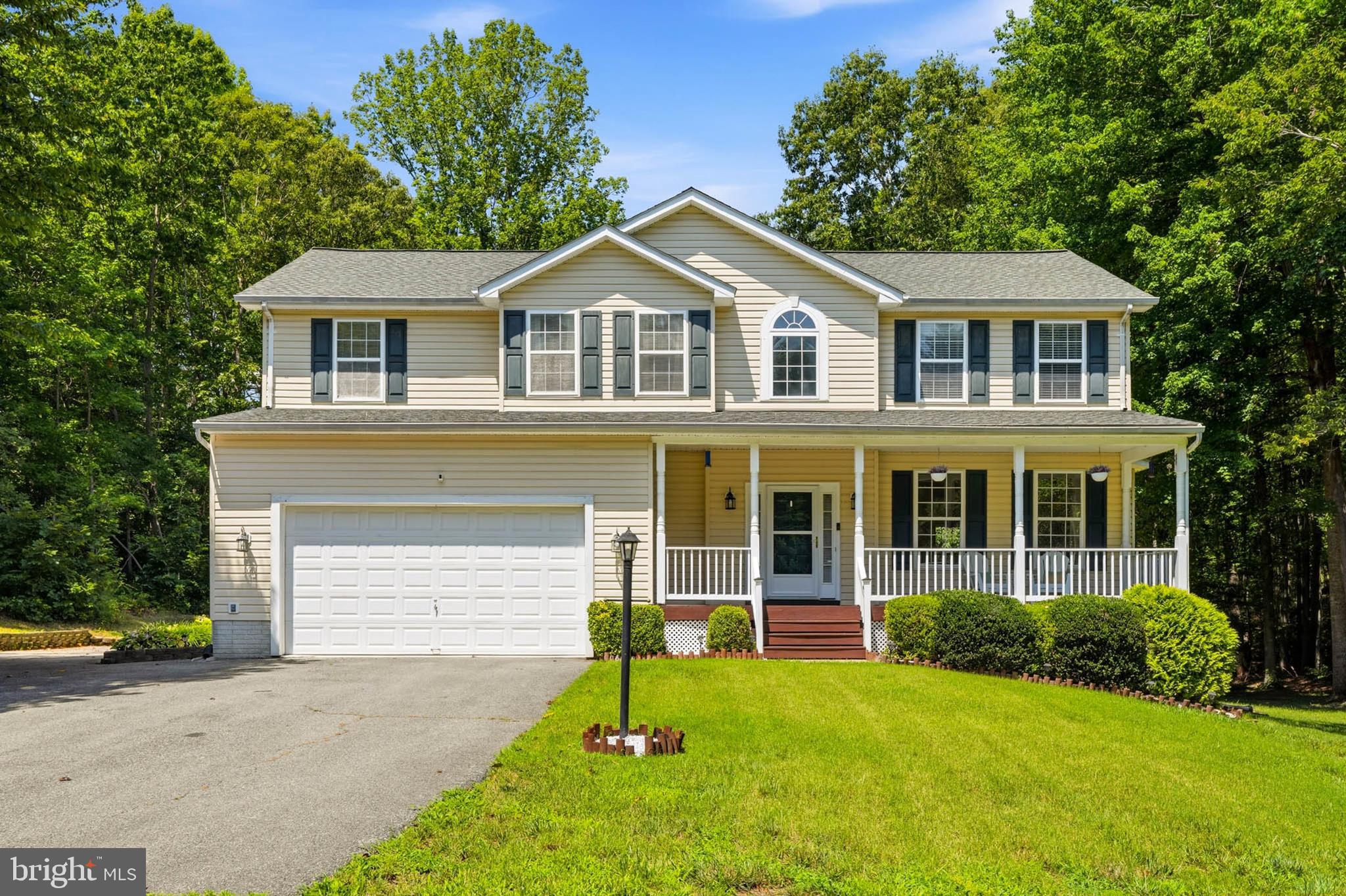 Welcome home to 4585 Mattapany Road, where peaceful country living meets everyday convenience. Nestled on nearly 1.5 private acres in the desirable Woodhaven community, this beautifully maintained Colonial offers approximately 3,300+ finished square feet of thoughtfully designed living space across three finished levels.
The main level features formal living and dining rooms, a welcoming family room with a cozy fireplace, and a generously sized eat-in kitchen with upgraded stainless steel appliances. Whether you’re entertaining friends or enjoying a quiet evening at home, the thoughtfully designed floor plan offers comfortable spaces for every occasion. The inviting covered front porch is the perfect place to enjoy your morning coffee while taking in the peaceful surroundings, while the expansive rear deck overlooks the private backyard—a wonderful setting for entertaining and making lasting memories.
Upstairs, you’ll find four generously sized, light-filled bright bedrooms, all featuring beautiful hardwood flooring. The spacious primary suite offers a walk-in closet and an en-suite bath with a double vanity, soaking tub, and separate shower. A full hall bath and a conveniently located upper-level laundry room complete the second floor.
The fully finished walk-out lower level offers exceptional flexibility with a spacious recreation room featuring high quality surround sound, a full bath, a wet bar with cabinetry and countertop space, and an oversized bonus room. Whether you need additional space for extended family, visitors, a home office, media room, fitness area, or hobbies, this versatile level adapts beautifully to your lifestyle. Let your imagination run wild!
Recent improvements include a new roof (2020), upgraded stainless steel kitchen appliances, a newer washer and dryer, and additional mechanical updates, providing added peace of mind for years to come.
Surrounded by mature trees, the property offers exceptional privacy and a peaceful setting to enjoy nature. The attached two-car garage and expansive driveway provide parking for at least 8  or more vehicles, making it ideal for entertaining, multiple drivers, boats, trailers, or recreational vehicles. 
Conveniently located just minutes from shopping, dining, schools, Solomons Island, and Patuxent River Naval Air Station, with an easy commute to Joint Base Andrews, Washington, D.C. and Annapolis this move-in-ready home offers the perfect balance of privacy and convenience. Discover the space, flexibility, and tranquility that make 4585 Mattapany Road a wonderful place to call home.
