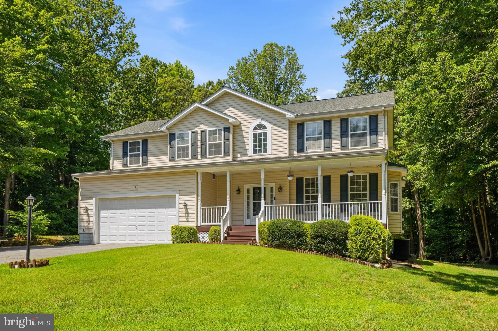 Welcome home to 4585 Mattapany Road, where peaceful country living meets everyday convenience. Nestled on nearly 1.5 private acres in the desirable Woodhaven community, this beautifully maintained Colonial offers approximately 3,300+ finished square feet of thoughtfully designed living space across three finished levels.
The main level features formal living and dining rooms, a welcoming family room with a cozy fireplace, and a generously sized eat-in kitchen with upgraded stainless steel appliances. Whether you’re entertaining friends or enjoying a quiet evening at home, the thoughtfully designed floor plan offers comfortable spaces for every occasion. The inviting covered front porch is the perfect place to enjoy your morning coffee while taking in the peaceful surroundings, while the expansive rear deck overlooks the private backyard—a wonderful setting for entertaining and making lasting memories.
Upstairs, you’ll find four generously sized, light-filled bright bedrooms, all featuring beautiful hardwood flooring. The spacious primary suite offers a walk-in closet and an en-suite bath with a double vanity, soaking tub, and separate shower. A full hall bath and a conveniently located upper-level laundry room complete the second floor.
The fully finished walk-out lower level offers exceptional flexibility with a spacious recreation room featuring high quality surround sound, a full bath, a wet bar with cabinetry and countertop space, and an oversized bonus room. Whether you need additional space for extended family, visitors, a home office, media room, fitness area, or hobbies, this versatile level adapts beautifully to your lifestyle. Let your imagination run wild!
Recent improvements include a new roof (2020), upgraded stainless steel kitchen appliances, a newer washer and dryer, and additional mechanical updates, providing added peace of mind for years to come.
Surrounded by mature trees, the property offers exceptional privacy and a peaceful setting to enjoy nature. The attached two-car garage and expansive driveway provide parking for at least 8  or more vehicles, making it ideal for entertaining, multiple drivers, boats, trailers, or recreational vehicles. 
Conveniently located just minutes from shopping, dining, schools, Solomons Island, and Patuxent River Naval Air Station, with an easy commute to Joint Base Andrews, Washington, D.C. and Annapolis this move-in-ready home offers the perfect balance of privacy and convenience. Discover the space, flexibility, and tranquility that make 4585 Mattapany Road a wonderful place to call home.
