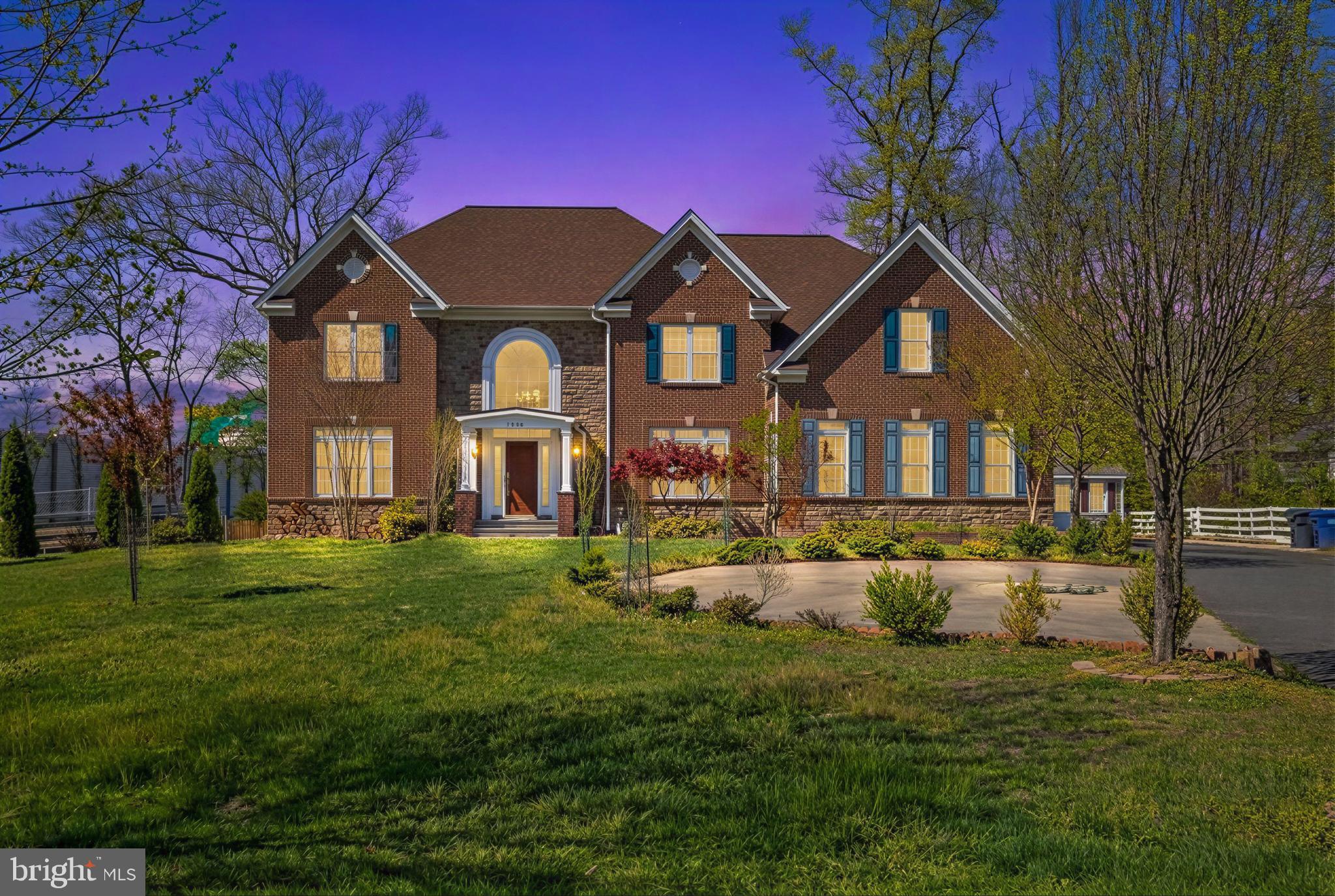 Beautiful Stone and Brick-front Colonial  set on a private 1.05 acre lot in  Falls Church.  At the front entry, a magnificent curved staircase welcomes you to the new built 10 year old home with well maintained 5 bedrooms, 5.5-baths residence offers a rare main level primary bedroom and full bathroom showcases grand architectural details throughout, including a two-story foyer and an impressive two-story family room features 2 story high Stone fireplace with elegant mantel and a complemented  a second rear staircase for added convenience.
Hardwood flooring throughout the main and upper levels, enhanced by extensive crown molding, recessed lightings, and ceramic tile baths. The gourmet kitchen is thoughtfully designed for both everyday living and entertaining, featuring stainless steel appliances, granite countertops, double ovens, an oversized center island, double sinks, custom tile backsplash, and a walk-in pantry.
Retreat to the luxurious upper-level primary suite, offering a spacious sitting area, dramatic cathedral/box ceiling, and a spa like bath with separate shower, private toilet room, and dual vanities and huge walk in closet.  All additional bedrooms are generously sized with with en-suite or nearby baths.
While the home does not include a basement, it offers a large, clean, and easily accessible crawl space ideal for extensive storage. Outdoor living is elevated with expansive, very level, front and rear yards, providing endless possibilities for entertaining or future enhancements. 
A two-car attached garage is complemented by an extra-long driveway accommodating 10+ vehicles, along with a substantial storage shed that conveys.
Ideally located near major commuter routes, transportation, shopping, and dining, this exceptional property seamlessly blends luxury, space, privacy, and convenience.  Much more about this home that you need to come and check it out.
