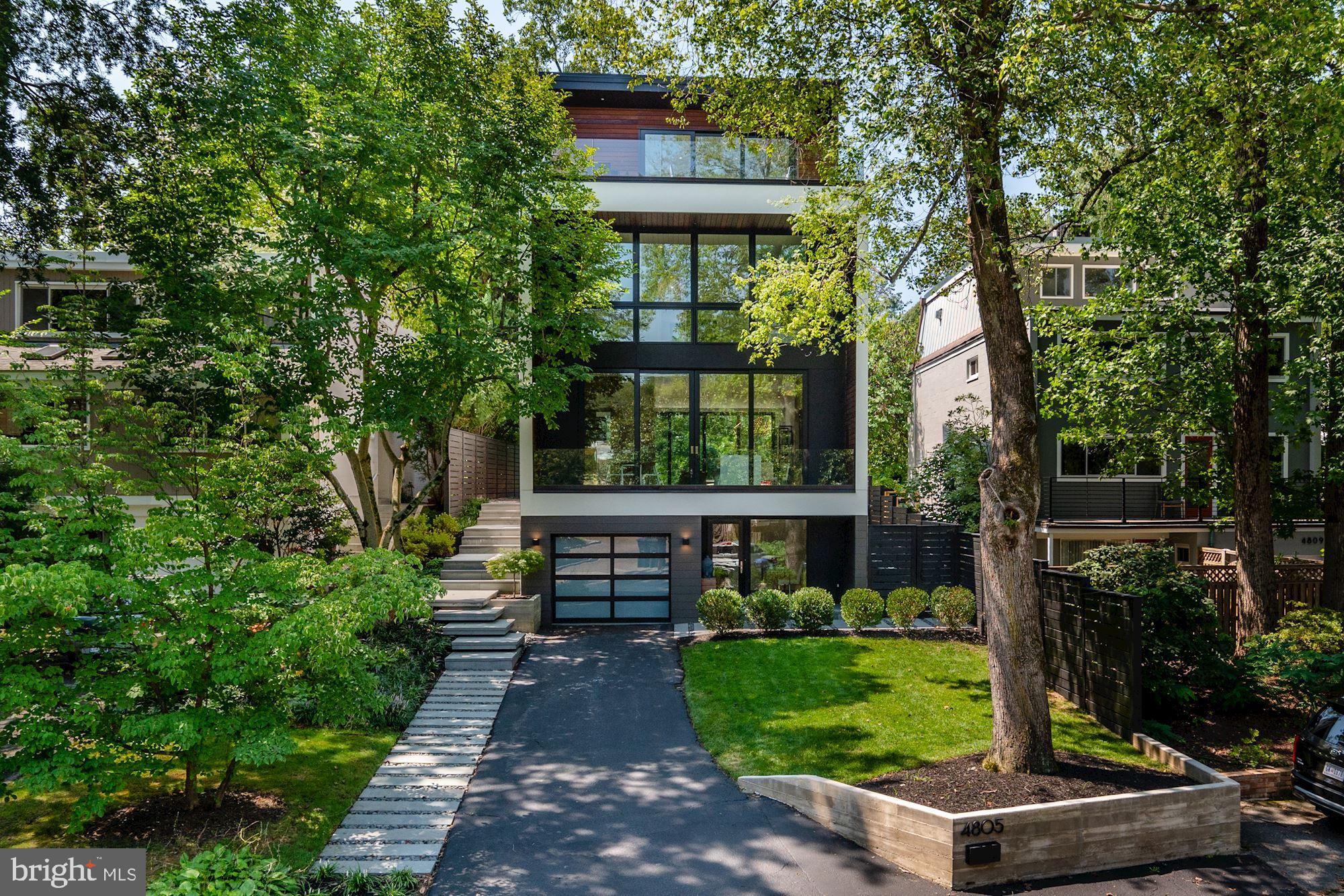 4805 Bending Lane NW is a remarkable modern showpiece perfectly situated atop the bluffs overlooking the Potomac River. This sensational Palisades residence presents an attractive and distinctive blend of subtle Scandinavian flair and dramatic elegance. Wide plank European white oak floors dress the open space and complement the airy layout. Impactful sightlines are elevated by the oversized windows and impressive 10’ sliding glass doors to create a seamless appreciation of both the indoor to outdoor spaces. Offering 5 Bedrooms and 4.5 Baths, this beautifully curated home showcases a desirable floor plan that spans approximately 5,492 total indoor and outdoor living SF and includes an open Main Level, a Lower Level Office with a separate entrance, a stunning Primary Suite, and 2 Roof Decks with combined 360-degree views. Located on a quiet cul-de-sac off Reservoir Road in the popular Palisades neighborhood, just steps from Fletchers Boat House, C&O Canal, the Capital Crescent Trail, and the local shops and restaurants of the Palisades.
