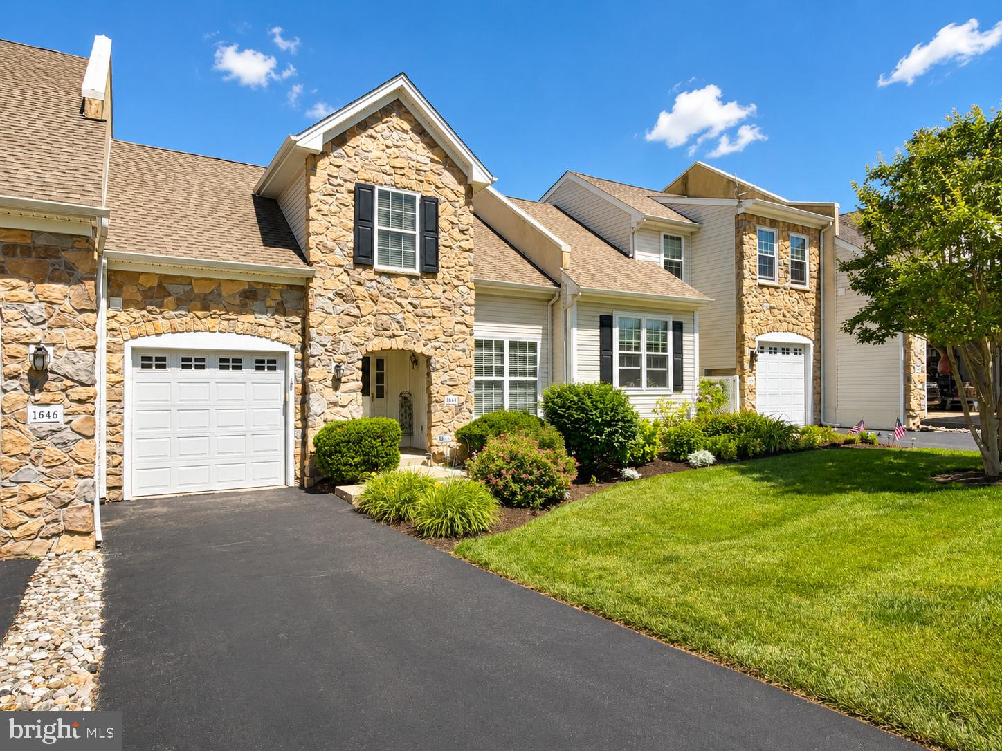 Welcome to easy living in this spacious 2-3 bedroom, 2.5 bath home in the highly sought-after FOXFIELD development. where comfort, convenience, and peace of mind are all rolled into one.  The owners lovingly maintained this beautiful home during their time here. Step inside to a welcoming foyer that opens to an expansive Living and Dining Room with soaring ceilings, hardwood flooring, and access to the raised deck overlooking peaceful views. The main-level Powder Room features ceramic tile flooring for added style and convenience. The bright eat-in Kitchen is designed for both functionality and storage, offering abundant 42" cabinetry, a lazy Susan, double pantry closet, generous countertop space, refrigerator, built-in microwave, dishwasher, disposal, and electric range. The spacious Primary Suite is conveniently located on the main level and includes a large walk-in closet, linen closet, private full bath, and nearby laundry area with washer and dryer included. Upstairs, you'll find a versatile loft that can serve as a den, office, family room, or third bedroom, along with an additional bedroom featuring its own walk-in closet and private full bathroom—perfect for guests or extended family. Additional features include gas heat, central air conditioning, electronic air cleaner, security system, and an attached garage with automatic opener. Enjoy resort-style living with close proximity to the community clubhouse and an impressive array of amenities, including swimming, tennis, golf, a fitness center, library, billiard room, card room, and numerous social activities. Don't miss your opportunity to own this beautifully maintained home that combines comfort, convenience, and an exceptional lifestyle.  ***Upstairs bedroom, loft and Bathroom photos will be uploaded tomorrow***