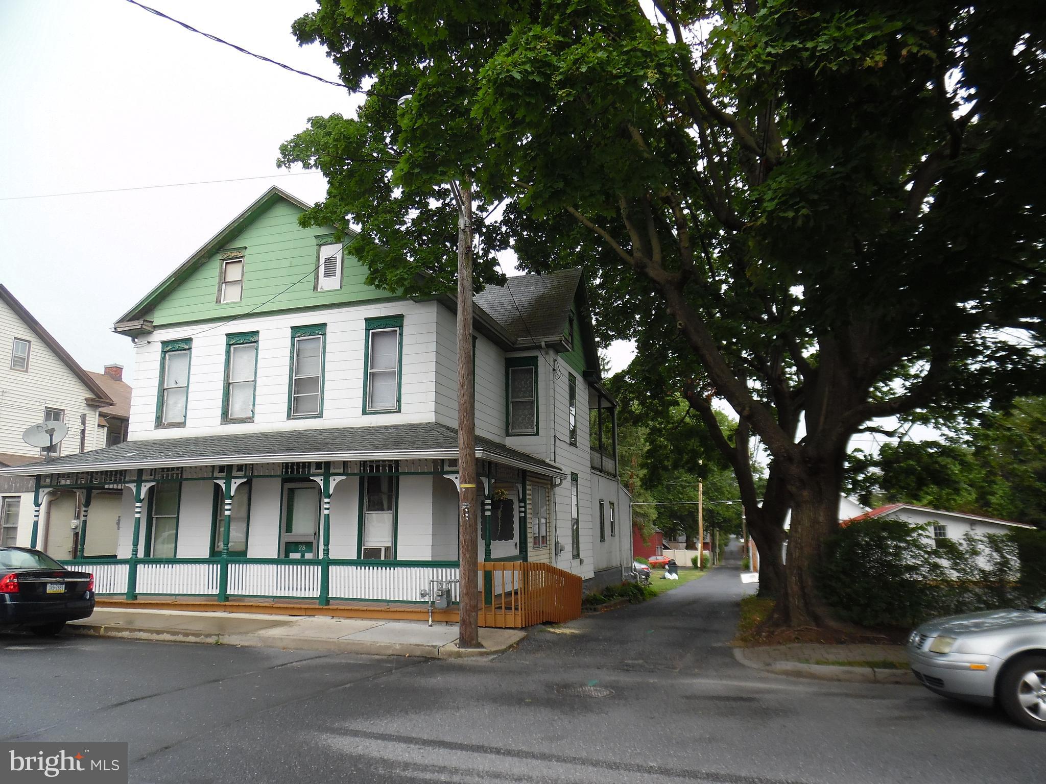 An unusual opportunity in Annville.  This property consists of TWO houses on one deed and a lot with road frontage on 3 sides.  The homes share a sewer line but are not accessible to each other.  28 has living room, kitchen, front room currently used as a bedroom, first floor bath and dressing room. There are 3 bedrooms on the second floor and a small bath that has not been used in many years.  the back bedroom has balcony access.  Both sides have a full attic and basement.  The basement in 30 has a ground floor, 28 is cemented.  the floorplan on the north side (30) consists of front room, living room, eat in kitchen on the first floor, 2 bedrooms and bath on the second floor.  This home is an estate and is being sold AS IS.  The heat is provided by Warm Morning gas heaters, one in each side. From 4/1 to 4/14/25 please refer all calls on this property to Tommy Bechtold.