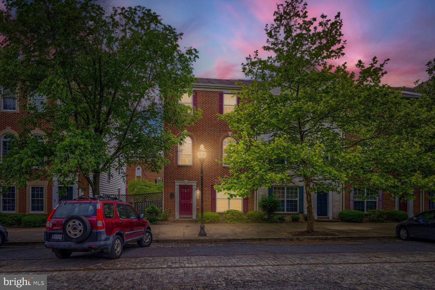 Welcome to 809 McHenry Street, the flagship model home of the sought-after Camden Crossing community, upgraded beyond every standard and now available for the first time in years. With 2,400 sq. ft. spread across three stunning levels, 5 bedrooms, 4 bathrooms, and a layout designed to impress, this is not just a home, it's a lifestyle statement in the heart of Baltimore.

From the moment you step inside, the 9-foot ceilings, crown molding, and sunlit open-concept living space signal that this is something different. The chef's kitchen flows effortlessly into a formal dining area and a 19-foot-wide living room bathed in natural light from three oversized windows. Step directly out onto your private entertainment deck, perfect for morning coffee, summer BBQs, or catching Ravens game day energy in the air.

What truly sets this home apart is the main-level suite. Originally converted by the builder, this 20-foot living area with a full en-suite bathroom is an incredibly rare find, ideal as a home office or additional suite.

Upstairs, the top-floor primary retreat features a dramatic vaulted ceiling, massive walk-in closet, dual exposures for incredible natural light, and a spa caliber en-suite bath with dual vanity, soaking tub, and separate stand-up shower. Two generously sized secondary bedrooms and in-unit laundry round out the upper level.

THE LOCATION IS UNBEATABLE.
Short distance to Camden Yards, M&T Bank Stadium, and to the University of Maryland Medical Center. The Pratt Street Light Rail puts you on the grid in minutes, while I-95, I-295, I-695, and I-83 make every commute effortless.

This is Camden Crossing's finest!