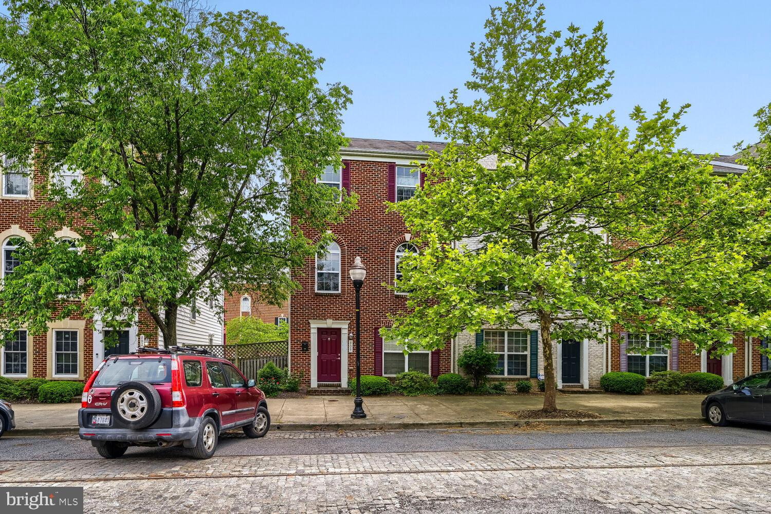 Welcome to 809 McHenry Street, the flagship model home of the sought-after Camden Crossing community, upgraded beyond every standard and now available for the first time in years. With 2,400 sq. ft. spread across three stunning levels, 5 bedrooms, 4 bathrooms, and a layout designed to impress, this is not just a home, it's a lifestyle statement in the heart of Baltimore.

From the moment you step inside, the 9-foot ceilings, crown molding, and sunlit open-concept living space signal that this is something different. The chef's kitchen flows effortlessly into a formal dining area and a 19-foot-wide living room bathed in natural light from three oversized windows. Step directly out onto your private entertainment deck, perfect for morning coffee, summer BBQs, or catching Ravens game day energy in the air.

What truly sets this home apart is the main-level suite. Originally converted by the builder, this 20-foot living area with a full en-suite bathroom is an incredibly rare find, ideal as a home office or additional suite.

Upstairs, the top-floor primary retreat features a dramatic vaulted ceiling, massive walk-in closet, dual exposures for incredible natural light, and a spa caliber en-suite bath with dual vanity, soaking tub, and separate stand-up shower. Two generously sized secondary bedrooms and in-unit laundry round out the upper level.

THE LOCATION IS UNBEATABLE.
Short distance to Camden Yards, M&T Bank Stadium, and to the University of Maryland Medical Center. The Pratt Street Light Rail puts you on the grid in minutes, while I-95, I-295, I-695, and I-83 make every commute effortless.

This is Camden Crossing's finest!