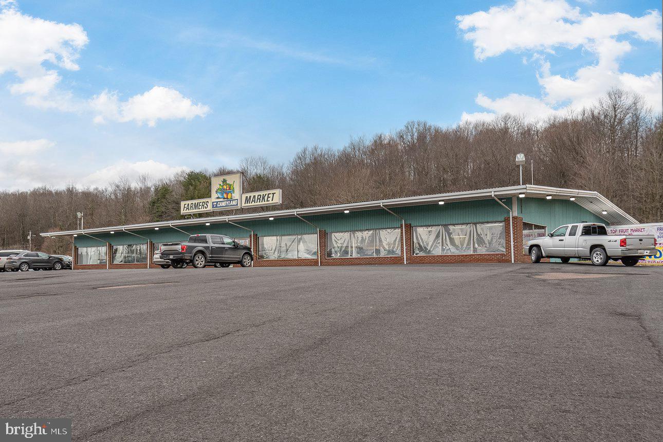 Successful turn-key business located in Oakland. This is a great opportunity to take over an established business or purchase the property for something else. Offering an abundance of candy varieties, syrups, cheeses, jellies, jams and many more items. Property sits on 4.64 acres of land is located in the heart of Oakland.  The prime road frontage is just one more appealing feature of this property.