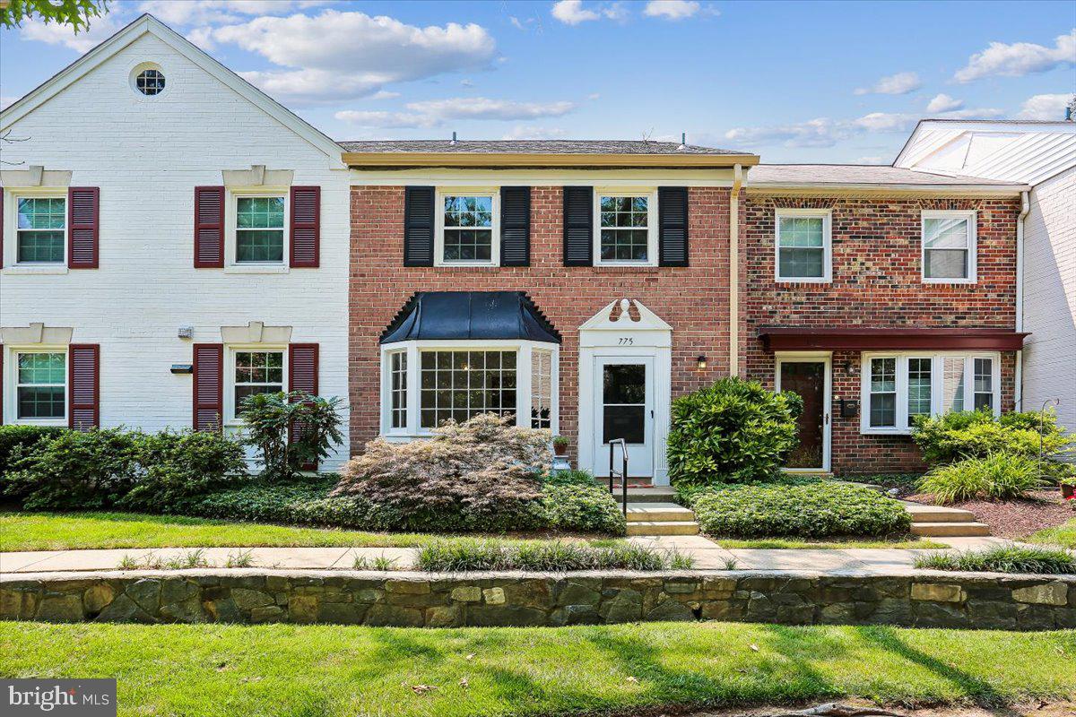 Picture perfect charming 3-bedroom storybook home in the sought after Regent Square community.  Freshly painted throughout, it features beautifully renovated bathrooms, an updated kitchen with generous cabinet space, and a spacious dining room with a delightful window seat with bay window. Enjoy the scenic view of the grand oak tree and surrounding open green space with benches.  The sun-filled living room opens to a fenced patio.  Upstairs offers a primary bedroom with ample closets and sparkling new private half bath featuring a barn door, two additional bedrooms, and a stunningly renovated full bathroom.  A full-size washer and dryer are conveniently located on the upper level.  This home is located in a most desirable location within Regent Square, including close by parking, and an abundance of open space right in front of the home.  Woodley Gardens Shopping Center  is only .3 miles away and  features the popular  Carmen's Italian Ice, Hard Times Cafe,  Z&Z Manoushe Bakery, Neighbors coffee shop, veterinarian, and dry cleaner.  Woodley Gardens Park offers tennis courts, baseball fields, basketball courts, playgrounds, and volleyball net.  Commuter's delight.  Easy access to I-270, 495, and the Rockville Metro.