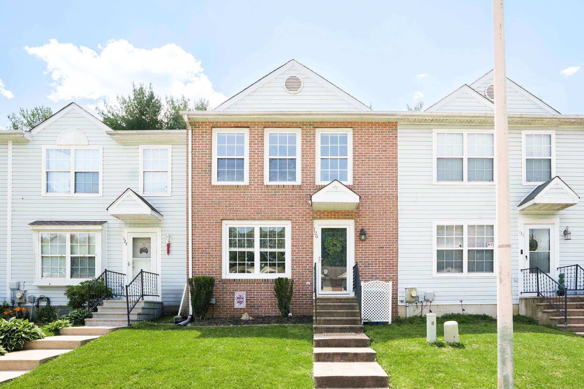There's no place like home! Welcome to this brick-front Timberbrook townhome featuring stylish updates and a convenient location just minutes from downtown North East. The main level offers a bright living room, separate dining area, and an updated kitchen with modern black cabinetry, stainless steel appliances, and pantry storage. Sliding glass doors off the dining area lead to the fenced backyard. Upstairs, you'll find two spacious bedrooms, including one with two walk-in closets and another with its own walk-in closet, plus a full hall bathroom with tub shower. The unfinished basement provides excellent storage space and future finishing potential. Major updates within the past few years include the HVAC system, hot water heater, upstairs carpeting, front and rear doors, and more. Conveniently located near shopping and dining in downtown North East and just minutes from Route 40 and I-95 for easy commuting. Schedule your showing today!