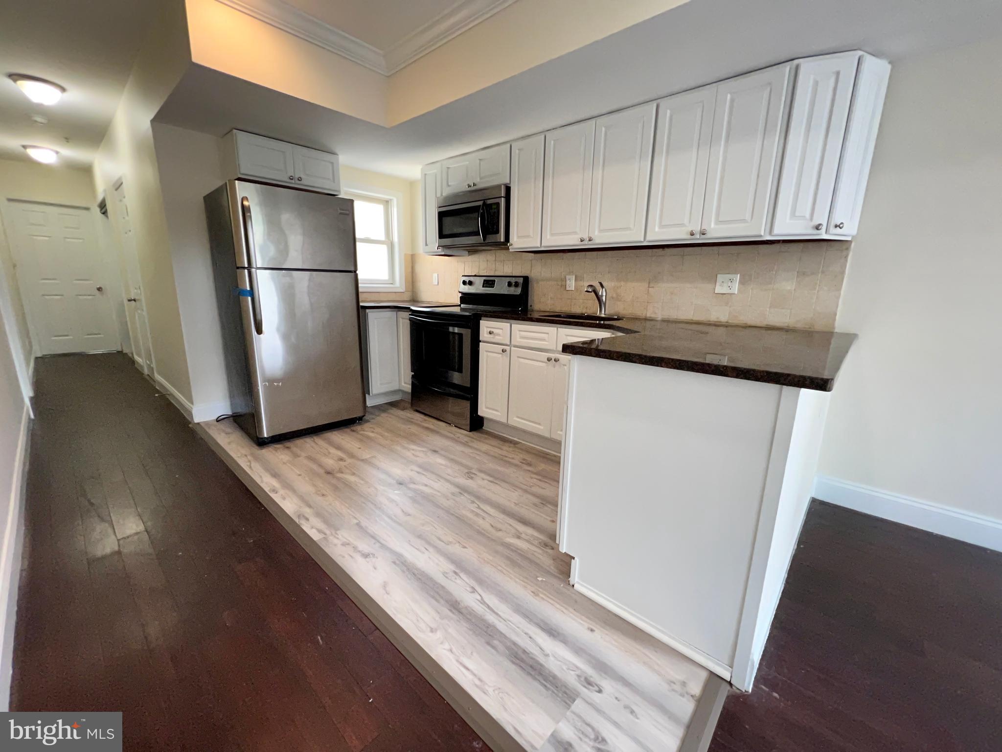 This 4-Bedroom/2-Bathroom apartment is located on the upper levels of a two-unit apartment building just outside Temple University. Only steps away from campus, you'll love being able to walk to class every day! You will also enjoy being surrounded by plenty of public transportation in the area as well. This beautiful apartment is available NOW and ready for immediate move-in!

Enter the apartment and immediately fall in love with the open concept floor plan that exists between the living room and kitchen. There is beautiful hardwood flooring that flows continuously throughout the living room, tall ceilings, and large windows which allow tons of natural light to pour in and make the entire space feel incredibly open and bright.

The kitchen has been recently renovated and looks stunning. It includes stone tile flooring, white cabinets with brushed nickel hardware, granite countertops, stainless steel refrigerator, four-burner gas range, and built-in microwave. There is also a tile backsplash which brings the entire design together!

This apartment includes four spacious bedrooms which all include hardwood flooring, ample closet space, and large windows which allow even more natural light to pour into the home. There are two full bathrooms which ensures there is plenty of privacy for everyone. The renovations continue throughout the bathrooms where you will find stone tile flooring and modern vanities with plenty of storage. The first bathroom includes a full-sized bathtub/shower while the second bathroom includes a shower stall with a custom tile surround!

There is a $75.00 water usage fee due in addition to rent each month. Tenants are also responsible for electric, gas, and cable/internet. Sorry, no pets permitted.

Application Qualifications: Minimum monthly income is 3 times the tenant’s portion of the monthly rent, acceptable rental history, acceptable credit history and acceptable criminal history. More specific information provided with the application.