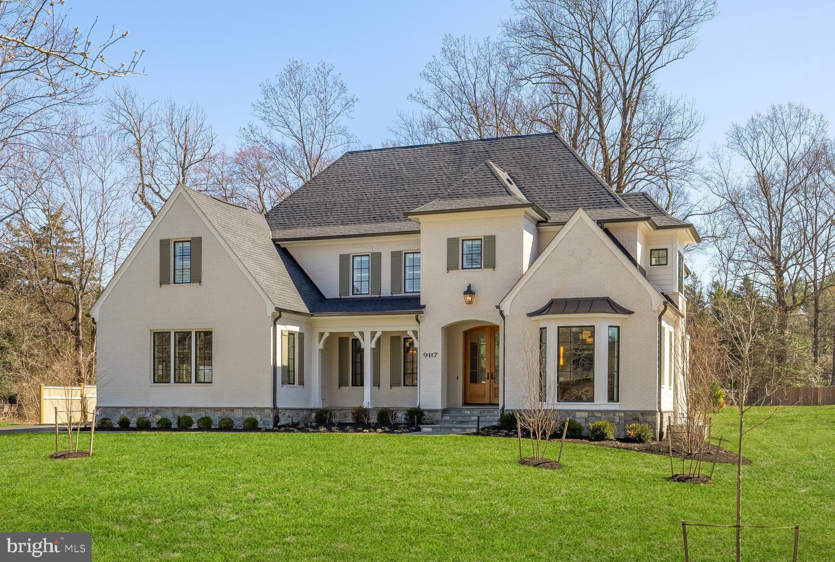 Crafted by Foxhall Homes and visioned by GTM Architects, this award-winning estate is a masterclass in refined living. Spanning nearly 7,700 square feet on a rare, level 0.56-acre lot, the residence balances grand proportions with intimate details. Featuring 6 bedrooms, 7 baths, and a private elevator serving every floor, it is a home designed for those who appreciate uncompromising quality and effortless flexibility. 
<br> <br>
Enter through 8-foot mahogany double doors into a gracious foyer, where a balanced layout effortlessly transitions from intimate family life to grand-scale entertaining. At the heart of the home, the kitchen stands as a focal point of design and utility: featuring an 8-foot island with inset cabinetry and leathered Taj Mahal quartzite.
<br> <br>
For the serious chef, the suite is unparalleled—anchored by a 54" JennAir column refrigerator and 48″ BlueStar gas range in custom grey-white enamel with brass accents. Renowned by Iron Chefs for their 22,000+ BTU open burners and 1,850-degree infrared broiler, this kitchen brings professional-grade performance into the warmth of your home. 
<br> <br>
Bathed in natural light, the family room is anchored by a stunning Francois & Co. Scagliola precast mantel. Oversized doors lead to a 19′ × 14′ screened porch, creating an effortless transition to the slate patio—complete with gas grill port and sprawling level yard.
<br> <br>
The mudroom marvels modern convenience, featuring custom built-in cubbies, a discreet half bath, and secondary laundry suite. With direct access to the 3-car garage, rear porch, and a private back stair to the upper level, it serves as the home’s high-functioning command center.
<br> <br>
Designed as a quiet sanctuary, the primary suite features custom inset cabinetry and a spa-inspired bath anchored by Kallista fixtures and heated flooring. Indulge in the deep soaking tub or the 7.5-foot double shower, complete with precision thermostatic controls.
<br> <br>
Bathed in southern light, the library is a sophisticated workspace defined by a deep bay window and custom built-ins topped with stunning Vancouver quartzite. It is an ideal setting for quiet reflection or focused productivity.
<br> <br>
Designed for versatile living and grand-scale entertainment, the lower level is a destination. Host game day in the sprawling recreation room, anchored by a 98-inch TV with cinematic Sonos surround sound system. Plus, The dedicated theater features integrated Klipsch audio for an immersive experience. A wraparound wet bar, private gym/flex room, and sixth bedroom provide the perfect sanctuary for guests, teens, or multigenerational living.
<br> <br>
The list of intelligent infrastructure and elevated finishes is extensive and includes: Andersen 400 Series Low-E casement windows with simulated divided lites, Tri-zone Carrier HVAC with 90%+ efficient gas furnaces, Ecobee thermostats, Aprilaire 800 steam humidifier, and media air filters, Epoxy-sealed garage floor and EV charging capability, LiftMaster Secure View Ultra-Quiet Belt Drive Garage Door Openers with Cameras, LED Corner to Corner lighting, and battery backup; Comprehensive Cat6 + HDMI wiring throughout, Klipsch speakers in Kitchen, Dining, Screened Porch, Rec Rm and Exercise Room, WiFi Mesh network, Security System, Video door bell rough-in, and landscape lighting, Solid core interior doors with Emtek hardware, Sound attenuation insulation around baths and master bedroom, High-end millwork and meticulously executed trim and detailing, Lighting from Visual Comfort featured throughout the home, Savaria Eclipse elevator with automatic internal door to all three levels. 
<br> <br>
9117 Redwood Avenue is designed to offer both prestige and purpose: elegant finishes, smart infrastructure, and flexible spaces for family life, all in one of Bethesda’s most desirabl