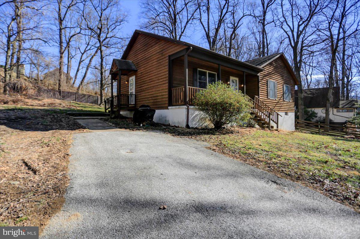 Fantastic three-bedroom rancher in Fairfield, PA. This well maintained rancher sits on over half an acre fenced lot and is located just around the corner from Ski Liberty Resort.  The full spacious basement is prime for finishing into more living space (roughed in for another bathroom) and has a walkout level sliding glass door with patio.   The primary bedroom has a walk-in closet that borders the current full bathroom and could easily be converted into an en-suite bathroom. Enjoy the privacy, low utilities (well and on-site septic) and super easy access to Maryland and neighboring towns like historic Gettysburg and Chambersburg. Schedule your private tour!