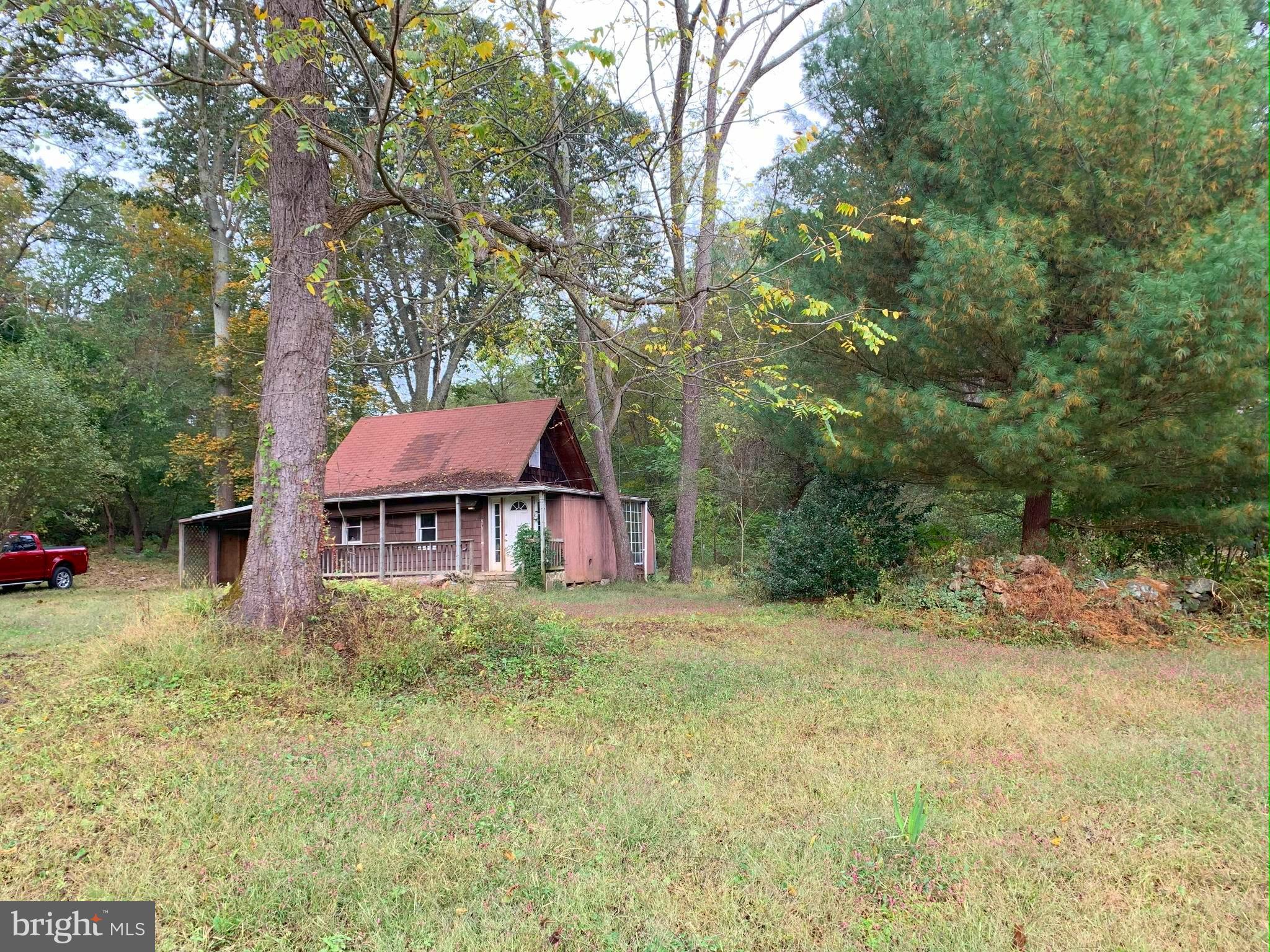 Homesteader Alert! Unique -6.92 Acre Property in Glen Rock, PA on the PA/MD Line – South Western School District!
Discover 6.92 acres of picturesque land in the South Western School District, offering a blend of mature trees, fruit trees, berry bushes, babbling creeks, abundant wildlife, and open pasture area. This serene setting is perfect for nature lovers, homesteaders, or those seeking a peaceful retreat.
A rustic A-frame cabin in disrepair sits on the property, ready for a complete rebuild or removal to make way for your dream home. With well and septic already on-site, the groundwork is in place for your vision to come to life. Proposed building plan previously approved in 2019 is attached in documents.
What makes this property truly one-of-a-kind is its location on the historic Mason-Dixon Line, spanning 3.80 acres in Pennsylvania and 3.12 acres in Maryland. Adding to its historical charm, a Mason-Dixon Crownstone, a rare and significant landmark, is located on the land.
Both parcels convey with the sale. See survey and building plan in the listing photos and schedule your visit today to experience this unique opportunity! No Entry into the cabin is permitted! Property being sold as is.