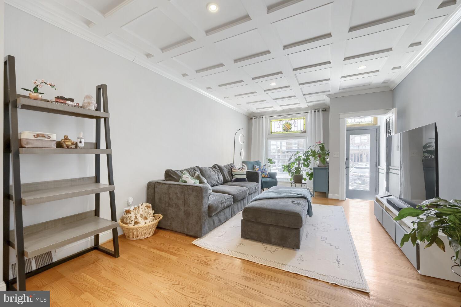Open House Sunday July 19th from 10am-12pm.  Welcome to 841 S. Conkling Street, a beautifully maintained brick-front townhome offering 2 bedrooms, 1.5 baths, approximately 1,406 square feet, and the priceless convenience of private off-street parking in the heart of Canton. The original third bedroom has been thoughtfully converted into a spacious walk-in closet and dressing room, with the flexibility to convert it back into a bedroom if desired.
Step inside to gleaming hardwood floors and elegant coffered ceilings that flow throughout the spacious living and dining rooms, creating a warm and inviting atmosphere. A convenient main-level powder room and gourmet kitchen make everyday living and entertaining effortless. The kitchen features granite countertops, stainless steel appliances, ceramic tile flooring, abundant cabinetry, a center island with seating, and plenty of workspace for preparing meals and gathering with family and friends.
Natural light fills the upper level through two skylights. The spacious primary bedroom offers generous closet space, while the second bedroom provides direct access to a private balcony, perfect for enjoying your morning coffee or relaxing at the end of the day. The beautifully converted walk-in closet offers exceptional storage and organization, while maintaining the option to restore the home’s original three-bedroom layout. A full bath completes the upper level.
The lower level spans the entire length of the home and offers incredible flexibility with abundant storage, a laundry area featuring front-loading washer and dryer, walk-out access to the rear parking pad, and an existing toilet providing the opportunity for a future bathroom expansion.
Recent improvements, including a new HVAC system and new front door, provide added value and peace of mind.
Outside, enjoy the convenience of your private rear parking pad, an amenity that’s truly priceless in Canton. Ideally located just minutes from Canton Square, Patterson Park, the Canton Waterfront, Johns Hopkins, shopping, restaurants, breweries, nightlife, and major commuter routes including I-95 and I-895, this move-in ready home offers the perfect blend of historic charm, thoughtful updates, abundant storage, flexible living space, and exceptional city convenience.