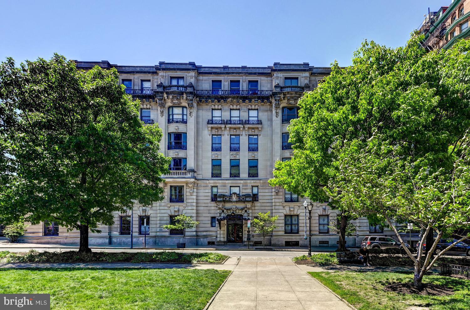 Located in the heart of Baltimore's historic Mount Vernon neighborhood, The Washington Apartments is one of the city's few premier co-op residences, offering timeless elegance and an unmatched urban lifestyle.  Built in 1906 in the grand Beaux Arts style, this distinguished building is rich in architectural character and perfectly positioned adjacent to the iconic Washington Monument and picturesque Mount Vernon Square.  Set within Baltimore's vibrant arts and cultural district, residents enjoy effortless access to world-class museums, theaters, galleries, acclaimed dining, and charming cafes - all just steps from the front door.  The co-op fee includes property taxes, heat, insurance, and 24-hour security, providing both value and peace of mind.  Unit 1B offers one bedroom and one bathroom.  Soaring 12 foot ceilings and oversized windows fill the home with abundant natural light, highlighting the beautifully preserved oak hardwood floors with intricate inlay detailing.  A decorative marble fireplace anchors the living room.