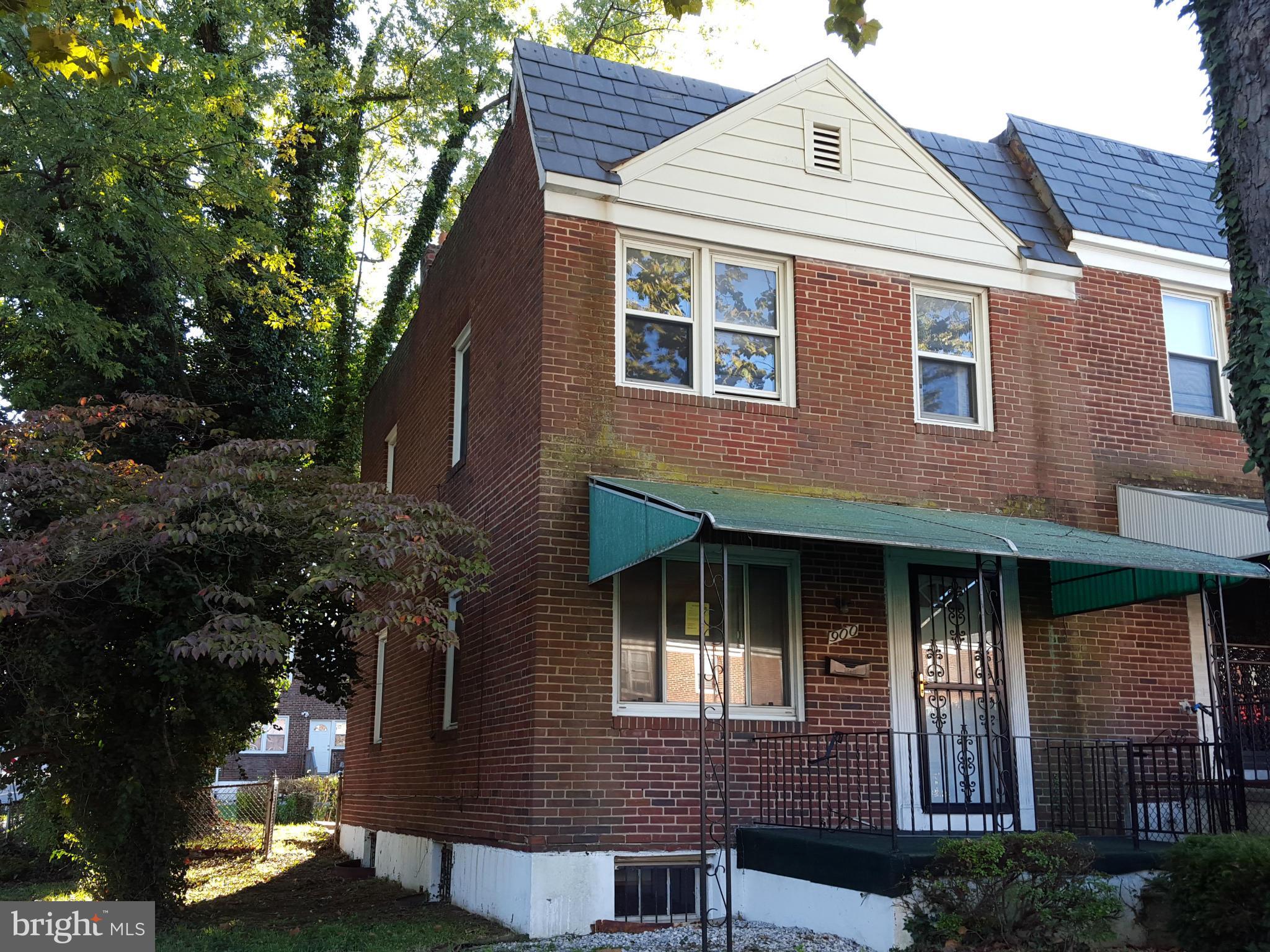 End unit treasure! This home offers great potential with a solid start. The home is a traditionally styled, all brick end home. The home has extra light from side windows, a nice fenced yard, and parking in the rear. The basement is part finished.  The main level offers a large living and dining area. Come take a look and bring your best offer!