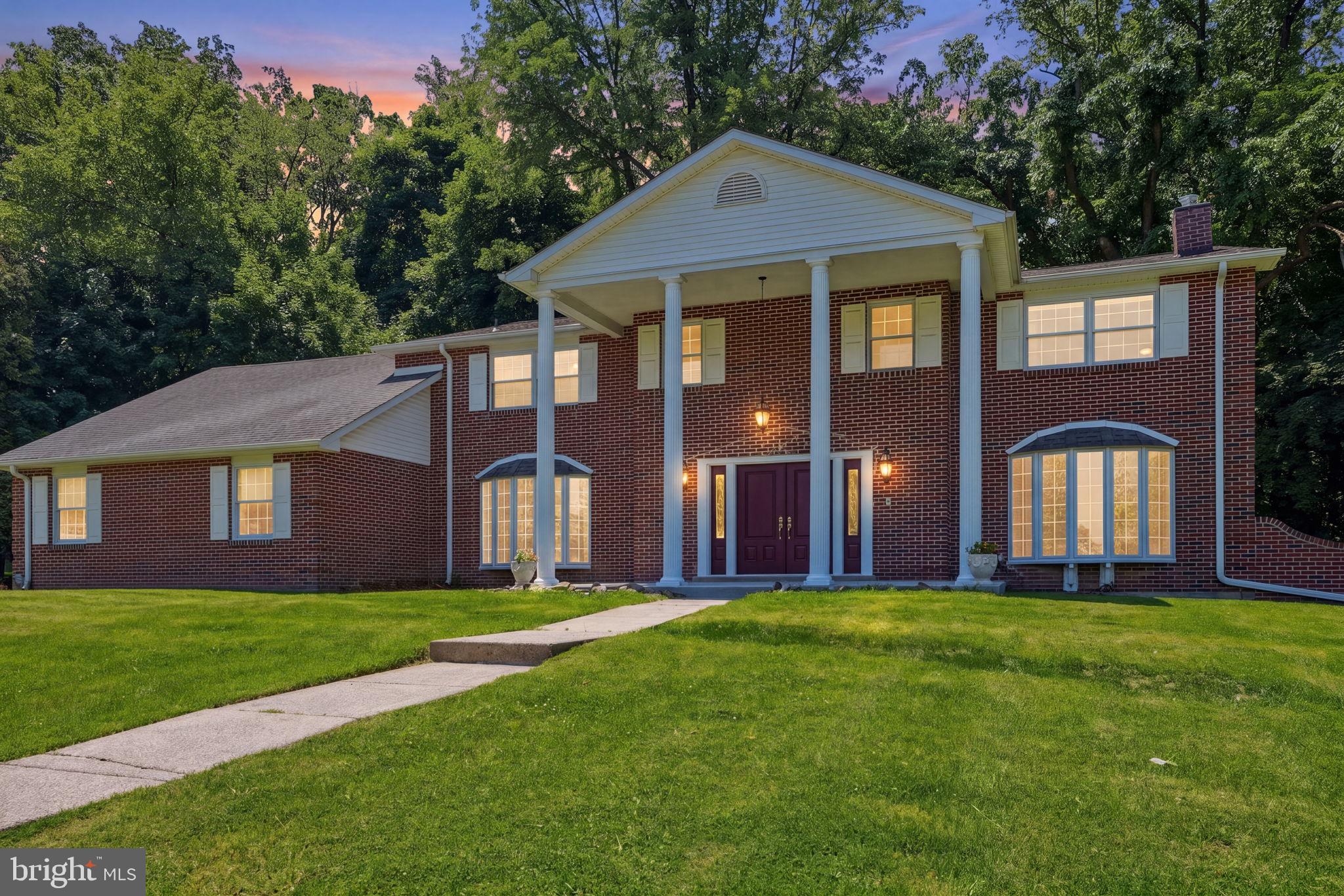 Ideally situated on the edge of Lorimar Park, 1840 Nicholas Drive stands as an expansive 5,700-square-foot home in the heart of Huntingdon Valley. The experience begins at the grand entrance, where a soaring foyer welcomes you into a home designed for entertaining and comfortable living. The main level flows effortlessly between formal and family living rooms, anchored by a classic office space and a dedicated formal dining room. At the heart of the home, the fully renovated chef’s kitchen boasts an abundance of workspace, premium cabinetry, and endless countertops. Nearby, the vibrant “Blue Room” has been purposefully designed as the ultimate gathering space for family celebrations. The second story is a spacious design, featuring six bedrooms and a versatile bonus room—perfectly suited for a custom dressing room, nursery, or secondary home office.  While the interior has been refreshed with new paint and flooring, the exterior has received equal attention, including newer siding, a new concrete front porch, and a freshly coated asphalt driveway capable of accommodating several vehicles. For those looking to customize, the unfinished walk-out basement offers a massive blank canvas with direct access to the side yard, ready to be transformed into a home theater, gym, or additional living suite. Living on Nicholas Drive means embracing a lifestyle of unparalleled peace on an extremely quiet block where the wonders of Lorimar Park serve as your own backyard. Enjoy a daily parade of deer and birds, outside of you windows or step outside to explore the natural hiking trails that wind through the park. With its perfect blend of massive square footage and a rare connection to the outdoors, this Huntingdon Valley estate offers a rare opportunity to own a private retreat without sacrificing convenience.