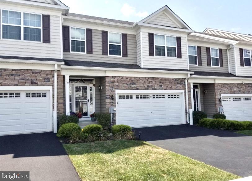 Welcome to this beautiful and meticulously maintained 3 Bedroom, 2 1/2 Bath townhome in the sought-after Providence Corner Community in Spring-Ford SD. This absolutely gorgeous move-in condition Townhome is loaded with upgrades. This is one of the few interior units with biggest and beautiful backyard of the community. As you enter into the foyer with newly upgraded waterproof premium laminated hardwood floors that flow throughout the entire first floor. The Great Room features a natural gas fireplace and recessed lighting and 2 large windows with the adjacent Dining area with beautiful chandelier and 3-Lite sliding glass door leading to the freshly stained back deck ideal for entertaining family and friends and gorgeous sunsets. The modern kitchen boasts 42" cabinetry, gorgeous granite countertops, a tile backsplash, new upgraded stainless-steel appliances, and a corner pantry for all your storage needs. Stainless appliances include a refrigerator, dishwasher, microwave, and range with 5 burner gas stove. The oversized island has plenty of space for barstool seating and 3 pendant lights. The open floor plan allows a great flow between the kitchen, eating area and large living room. A Half-Bath with pedestal sink completes this level. 
Head upstairs where the over-sized loft area with recessed lighting provides flexible space for a bonus office, sitting or play area. Double doors lead you into the large Owners bedroom suite which has double windows and offers recessed lighting and ceiling fan with large walk-in closet and Full-Bath with a high double vanity & oversized glass door shower. 2 more spacious bedrooms with double closets and a Full Hall Bath with tile shower/tub combo. Don't forget the convenient laundry room to complete this level which includes a utility sink and shelves. Whole 2nd floor has recently upgraded premium carpet.
Head back downstairs to the Finished Walk-Out Basement with plenty of natural light from the window and sliding doors to the patio. Basement level boasts: allure flooring and recessed lighting, storage, a bar area with a cabinet and refrigerator. 
This home includes remote controlled window treatments throughout the home by Serena shades (room darkening in bedrooms). Automated motion sensor lights are installed in all baths and laundry room. 
The flooring of the home (wood and carpets) has been recently upgraded and home has been freshly painted and all the new owner needs to do is move-in. 
2 car garage with opener and driveway for 2 additional cars and includes a big utility sink and two big cabinets with countertops. This community is located directly across from PJP High School and minutes from major employment centers, Providence Town Center, and local shopping with easy access to route 422 making it the perfect place to call home! This unit is a great value for the space, make your appointment today!