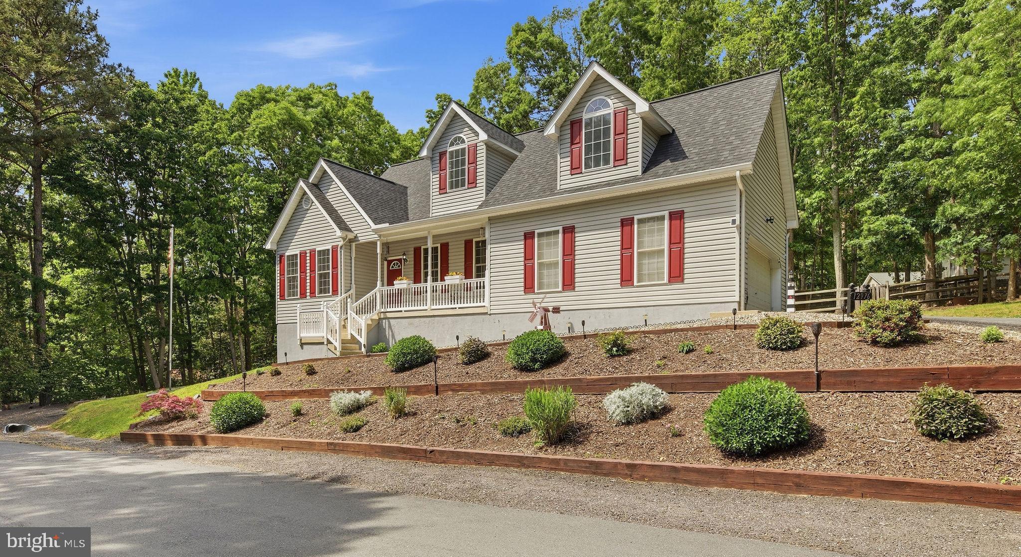 Welcome to 12976 Mariners Circle — where the ceilings are high, the yard is huge, and all life’s amenities are nearby.
Sitting proudly on a quiet corner double lot, this home brings the kind of space and flexibility that’s getting harder and harder to find. Need room for your RV, boat, trailer, or the “I swear I’ll use it every weekend” outdoor toys? Done. There’s extra parking just for that.
Inside, the open floor plan hits you immediately with soaring two-story cathedral ceilings and a layout built for real life. The kitchen is ready for everything from pancake Saturdays to playoff parties with granite countertops, a giant breakfast bar, tons of cabinet space, and enough prep room to pretend you’re on a cooking show.
The living room keeps things cozy with a propane fireplace and flows right out to the large deck overlooking the private fenced backyard — perfect for cookouts, enjoying nature, or simply hiding from people.
The main-level primary suite means no hauling laundry baskets up the stairs. You’ll get a spacious walk-in closet and private en-suite bath, while upstairs offers two generously sized bedrooms and another full bathroom.
Downstairs, the walkout basement is nearly fully finished and ready for movie nights, football Sundays, a home gym, game room, or all four at once. Plus there’s a full bathroom and plenty of storage for holiday decorations you swear you’re going to organize someday.
And let’s talk practical upgrades: BRAND-NEW Septic System installed June 2026, the roof and HVAC have both been replaced within the last five years, plus brand-new front and back doors installed in 2026. This means less stressing and more enjoying.
Add in the oversized side-loading two-car garage with workbench, a large side yard, storage shed, and a peaceful setting, and you’ve got a home that feels equal parts functional, fun, and impossible not to love.