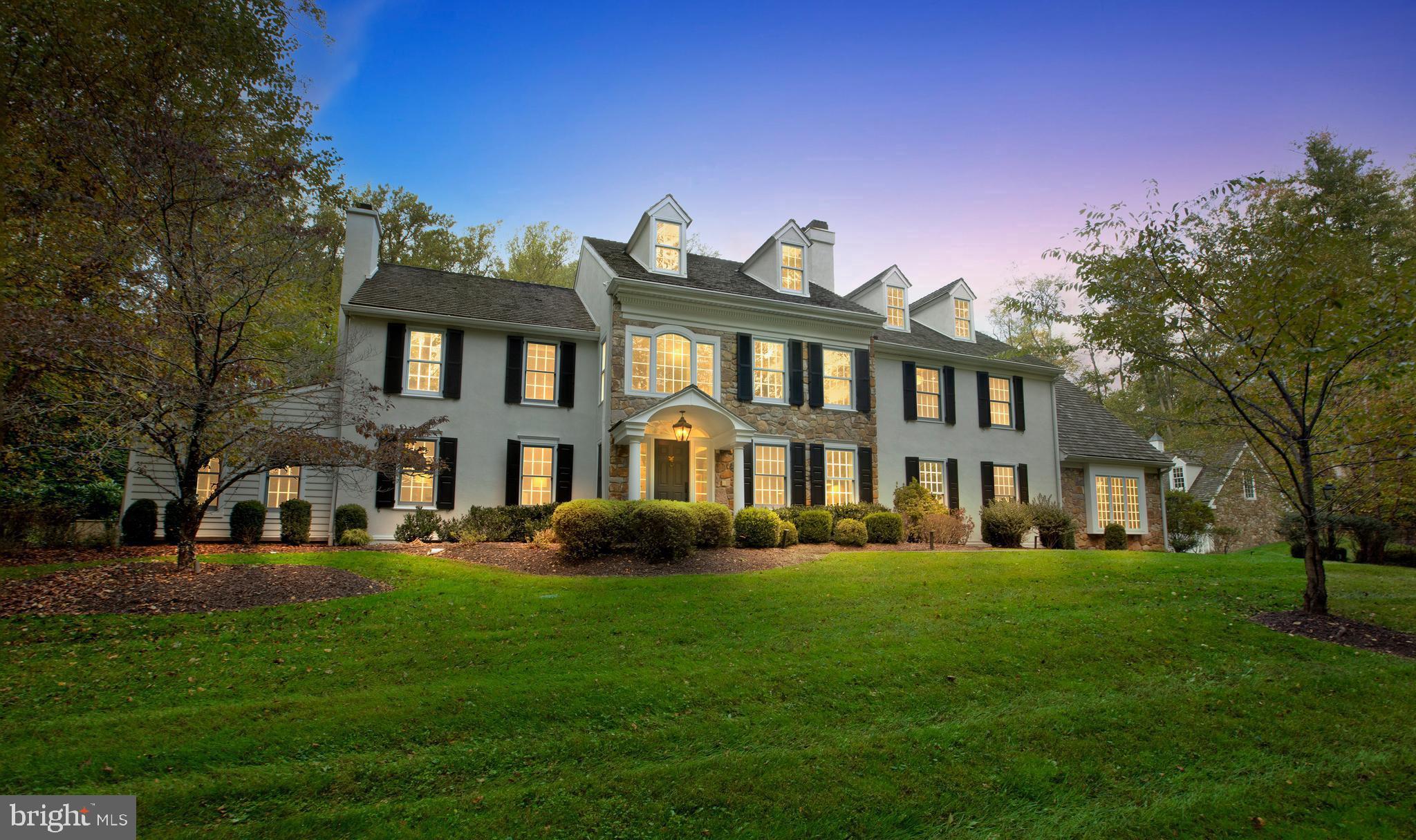 Welcome to 400 Dutton Mill Road, a beautifully updated private estate nestled on 4.7 acres in the coveted Radnor Hunt community. Offering over 5,000 square feet of comfortable elegant living space, lush landscaping, impressive hardscaping, and a luxurious pool w/ hot tub, all in a serene country setting on the Main Line. The gated entrance and winding drive set the tone for this charming manor with a classic yet contemporary vibe. Step into the impressive 2-story foyer with wainscoting, crown molding, and espresso hardwood floors that continue throughout. A formal Living Room features crown molding and beautiful arched built-ins that surround the wood burning fireplace, as well as offers an additional sitting area. The formal Dining Room with crown molding, handsome light fixtures & wall sconces, and adjoining butler’s pantry is a sophisticated space that makes hosting dinner parties a breeze. The chef inspired eat-in Kitchen with thoughtful details throughout boasts stylish two-tone cabinetry, high-end appliances & countertops, tile backsplash, center island with sleek range hood & counter seating, and a bright breakfast room w/ marble surround fireplace and access to the back patio, making this space perfect for casual meals with family & friends and dining al fresco in the warmer months.  A dramatic Family Room with dark tones, recessed lighting, beamed ceilings, wet bar, and a built-in shelving flanked stone fireplace offers a cozy space to gather, while the adjoining bonus room features cathedral ceilings, a gorgeous window allowing for plenty of natural light,  & outside access that lends itself to the perfect entertainment space. A corner office, oversized mudroom with storage, and Half Bath complete the first level. Head upstairs to the Primary Bedroom ensuite featuring two custom closets, gas fireplace, and gorgeous Full Bath with two vanities, frameless glass shower, and separate soaking tub. 4 additional Bedrooms, 2 Full Baths, and a laundry room complete this level. The Finished Basement provides plenty of space for a game room, playroom, theater, and additional storage. The tranquil back yard offers a serene setting to start and end your days, whether drinking coffee or tea on the blue stone patio, relaxing by the fire-pit, or taking a dip in the heated pool & hot tub. In addition, above the detached three-car garage is a fully finished living area with approximately 800 sq ft of living space w/ full bath that could be used as a pool house, au pair suite, or gym. Perfectly situated in the highly ranked Great Valley school district, and just minutes from local shopping & dining as well as major highways and public transportation, you won’t want to miss out on this truly remarkable home. ((Don't miss agent remarks for an additional incentive))