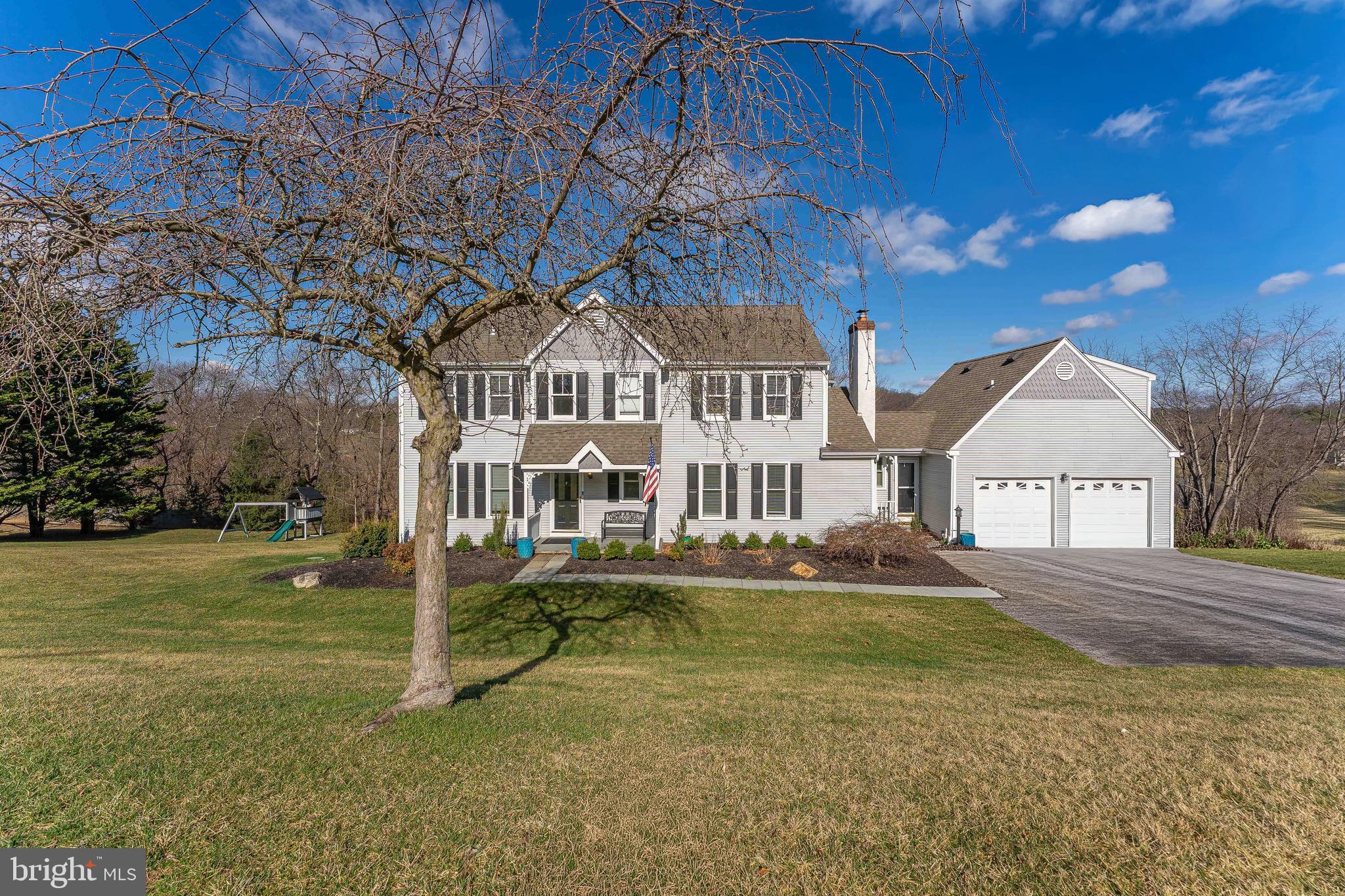 Welcome to 8 Matthews Run, a 4-bedroom, 4.5-bath colonial home located in the desirable Yellow Springs Cross community of Chester Springs. Set on a 1.7-acre lot, this property offers exceptional outdoor living with an expansive deck, a patio below, and plenty of open space to enjoy. As you approach, a long driveway leads to the two-car garage and a walkway to the front entrance. Inside, the foyer features a combination of tile and hardwood flooring, with a convenient powder room nearby. The living room offers hardwood floors, crown molding, and a decorative stone fireplace, flowing into the formal dining room with hardwood floors, crown molding, chair rail with wainscoting, a chandelier, and French doors to the deck. The kitchen is well-appointed with hardwood floors, quartz countertops, and stainless steel appliances, and opens to the breakfast room, which features hardwood flooring and two sliding doors to the deck, perfect for everyday living and entertaining. The adjacent family room includes hardwood floors, crown molding, built-in cabinetry, and a wood-burning fireplace. Completing the main level is a mudroom with tile flooring, a separate front entry, and access to both the garage and the in-law suite above. The in-law suite above the garage features a bedroom with carpeted flooring and a vaulted ceiling and an en-suite full bathroom with tile floors and a walk-in shower, making it ideal for multi-generational living or use as an au-pair suite. Upstairs in the main home, the primary suite features an attached sitting area currently used as a spacious closet, along with a private en-suite bath with tile flooring and a walk-in shower. Two additional bedrooms with carpet flooring share a full hall bath with tile floors and a tub/shower combination. The finished lower level expands the home’s living space with a rec room featuring luxury vinyl plank flooring and direct access to the patio and yard. This level also includes a home gym, a full bathroom with a walk-in shower, a bonus room ideal for a playroom or hobby space, a cedar closet, and a laundry room. Located in a community known for its spacious lots and peaceful setting, this home offers both privacy and convenience, with easy access to Route 76 for commuting. Don’t miss the opportunity to make 8 Matthews Run your new home.