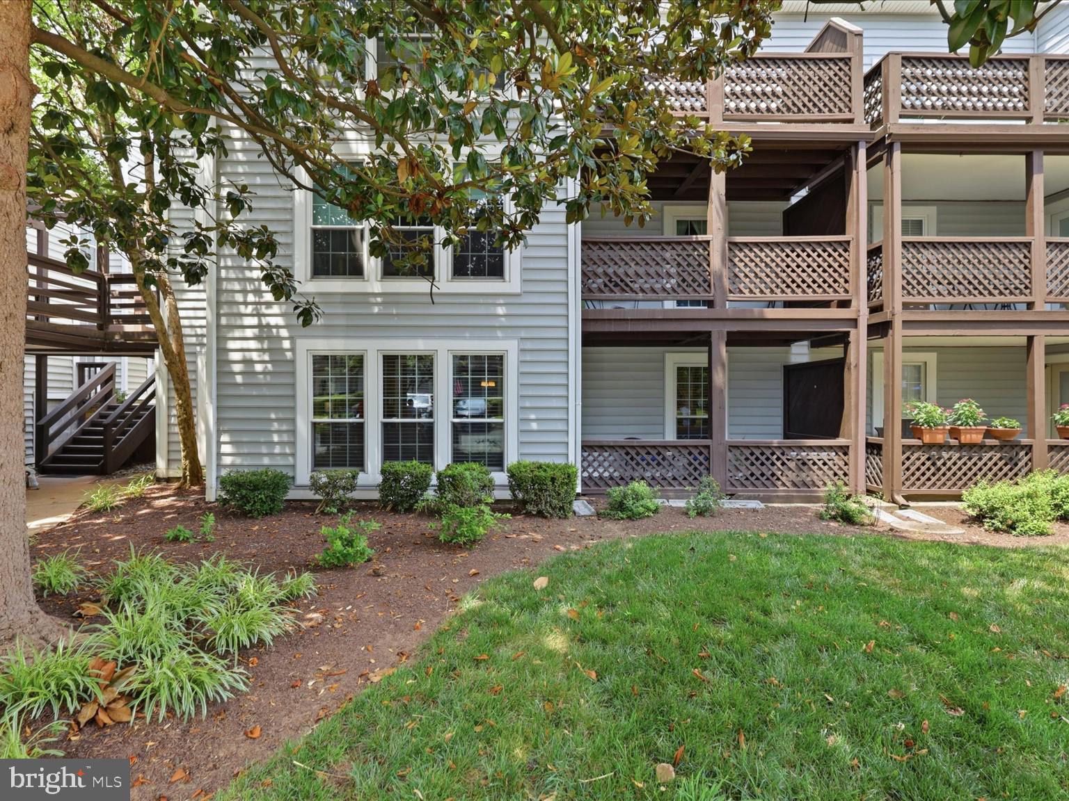Rare Opportunity in The Oakton! This beautifully updated one-bedroom plus den condo offers a highly sought-after floor plan featuring a sunroom, private patio, and true one-level living, a combination rarely available in this popular community. Ideally situated on the ground level at the quiet rear of the neighborhood, this home enjoys a peaceful setting surrounded by mature trees and lush landscaping.
Step inside to discover an inviting, move-in-ready interior with durable engineered hardwood flooring, recessed lighting, and abundant natural light throughout. The spacious living room is centered around a cozy wood-burning fireplace, creating the perfect place to relax, while the adjoining dining area flows seamlessly into the bright sunroom with direct access to the private patio ideal for morning coffee, outdoor dining, or simply enjoying the tranquil surroundings. A versatile bonus room provides the perfect space for a home office, guest room, fitness area, or hobby room, adding flexibility rarely found in one-bedroom homes. The updated kitchen features upgraded cabinetry, granite countertops, Whirlpool stainless steel appliances, and ample storage. A dedicated laundry room includes a full-size washer and dryer along with custom built-in cabinetry for exceptional organization. The renovated full bath is finished with tile flooring, an updated vanity, modern fixtures, and tasteful finishes. Whether you're a first-time buyer, downsizing, or looking for an outstanding investment, this turnkey home offers the perfect blend of comfort, functionality, and location. The Oakton, a pet friendly garden-style condominium community of just 240 homes, enjoy beautifully maintained grounds and a community swimming pool conveniently located directly across from the unit. Commuters will appreciate being just one mile from the Vienna/Fairfax-GMU Metro Station and I-66, with easy access to Route 123 & 50! Outdoor enthusiasts will love nearby Blake Lane Park, while plenty of shopping and dining options in the Town of Vienna and surrounding Oakton area. Don't miss this rare opportunity to own one of The Oakton's most desirable floor plans. Schedule your private tour today!