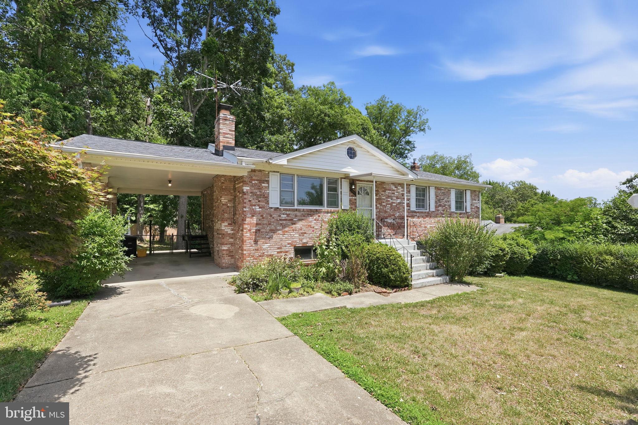A charming and spacious raised ranch style home, perfectly situated in a friendly community with easy access to DC. You will appreciate the comfortable and convenient layout. *The main level offers 3 generously sized bedrooms and 2 full baths, including a private primary suite. *The bright living room provides plenty of space to relax, while the separate dining area and spacious eat in kitchen make gathering with family and friends a breeze. *New wall to wall carpeting adds warmth and comfort, with original hardwood floors preserved underneath. *The finished lower level expands your living space with a large rec room, a 4th bedroom, and full bath- perfect for guests, home office, or multi-generational living. *Outside, a large fenced backyard offers privacy and room to play,  garden, or entertain. *An attached carport, new roof, and recent updates add convenience and peace of mind. *With its inviting spaces, flexible floor plan, and convenient location, this home is ready to welcome its next owners.