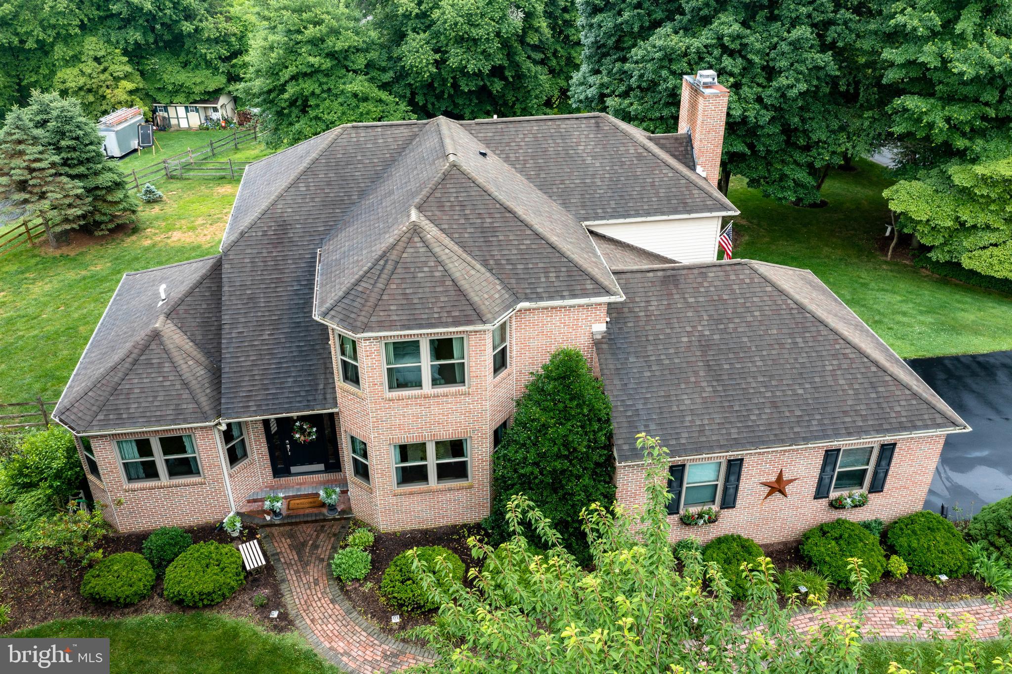 A peaceful tree lined street welcomes you to this new listing in the much sought after Fox Trail community. Situated on a 1 acre parcel, this custom designed and built home was constructed for enjoying life at its finest. The meandering lighted brick paver walkway leads you to the front door. The center hall 2 story Foyer with hardwood flooring  flows through the oversized entries to the Living Room on one side with a formal Dining Room on the other. There is also a sunroom off the living room with abundant sunlight which is delightful. The centrally located Kitchen is the heart of the home. Natural cherry cabinets , granite counters with under cabinet lighting, center island with overhang for seating. Stainless appliances. (refrigerator new in 2023). Oversized tile flooring with tiled backsplash and pantry. Breakfast  Area with custom half wall and shelving niche. There are casement windows that overlook the backyard.  Sliders leading out to the multi-level deck with new decking and 2 sets of stairs to the ground. Just off the kitchen is the spacious family room with a handsome floor to ceiling brick gas fireplace and slider access to the multi-level deck. Enter from the oversize 2 car garage to a Mudroom/hallway with access to laundry room and powder room complete the 1st floor. Stairs to the upper level are between the sunroom and the kitchen. The upper level features a Primary Master Suite with a large walk-in closet with custom built-ins, and the ensuite Bath with jetted tub and walk-in shower, double bowl vanity with Corian counters. There are 2 other generous sized bedrooms with lots of closet space that share a central hall bath. The lower level includes an open floorplan that features a game room with pool table included, along with 2 other flex rooms that can be whatever you want them to be. Exercise room (complete with treadmill and bike if you like) , craft room, 4th guest bedroom, office.  The lower level is a walk out to a lovely slate patio and has plenty of storage space as well. Outside enjoy the private open corner lot that offers mature trees and a fenced in area perfect for pets or possibly a pool. NEW 2023 decking, NEW 2023 refrigerators (2 included), NEW 2024 washer & dryer included. HVAC with humidifier and air cleaner (New 2019),  All exterior doors and windows have been replaced. NEWER driveway. This home is located in bucolic West Bradford Township just off of Rt 322 between West Chester and Downingtown. Award winning Downingtown School District and Stem Academy. Convenient to all major highways and the train. Seller is a licensed real estate agent.