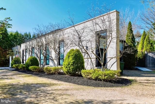 Designed for distinguished living and high-level entertaining, this gated 7,000+ square-foot Forest Hills estate offers a rare combination of modern luxury, privacy, and diplomatic-scale functionality—set in one of Washington, DC’s most secure and prestigious enclaves.
Approached by a gated U-shaped driveway, the residence immediately conveys estate presence while providing exceptional off-street parking and discrete access—ideal for executive households or diplomatic use. Inside, the home delivers expansive, light-filled interiors with a clean, contemporary sensibility layered over timeless architectural proportion.
The thoughtfully designed layout includes 4 bedrooms, Additional rooms in the basement can be flexible uses.  five full baths, and three half baths, allowing for staff accommodations, guest suites, entertaining zones, and work-from-home. Formal  rooms transition seamlessly, offering flexibility for both intimate living and high-capacity receptions. To adapt to your lifestyle, enjoy a versatile lower level ready to be tailored to  your needs.
At the core of the home, a chef’s kitchen combines sleek design with professional-grade performance, opening to multiple living and dining areas well-suited to hosting international gatherings or executive-level events. The flow between spaces supports effortless entertaining while maintaining privacy throughout the residence.
Outdoors, the property rivals a private resort. A saltwater swimming pool, paired with a separate pool house, creates an exceptional environment for summer receptions, diplomatic socials, or quiet retreat. Rooftop deck off Primary suite offers private outdoor space overlooking the pool.  Mature landscaping enhances security and serenity while preserving openness and light.
Additional features include a two-car garage, abundant storage, and infrastructure well-suited for modern living and security-conscious ownership. Every element of the property has been curated to meet the expectations of global executives and diplomatic residents seeking comfort, discretion, and prestige.
Located minutes from embassies, Rock Creek Park, Metro access, and Washington’s most respected public and private schools, this Forest Hills residence represents a rare opportunity to secure a modern diplomatic-caliber estate in the heart of Northwest Washington.