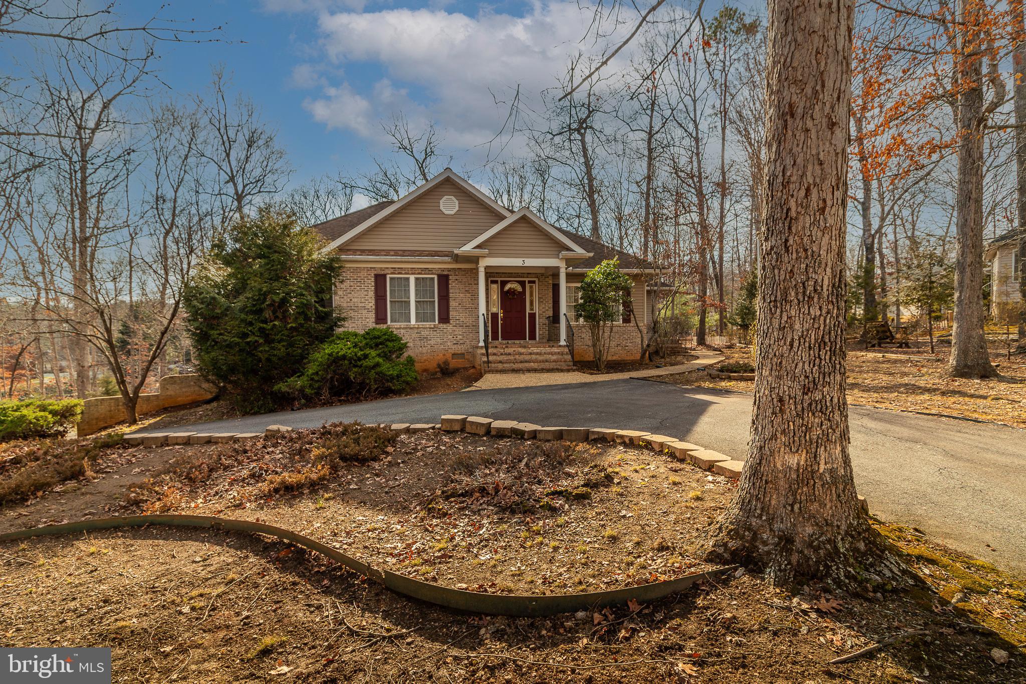 Priced below Tax Assessment!! Come Home to this Gorgeous 3 Bedroom 3.5 Bath Rambler on a 0.54 acre lot. Circular paved driveway and access paved Driveway to the side load 2 car oversized Garage. Home features Brick Front, Covered Brick entry-Way, Concrete walkways  to side Door and from back Patio to  Driveway. Deck with Staircase to Ground Level. Enjoy the Open Light and Airy feeling of the Raised Ceiling, Hardwood Floors and cozy Fireplace that Greets you as you enter! Living Room and Dining Room features Hardwood Floors and Sliding Glass Door to Deck.Kitchen features Double sink, Built in Dishwasher,Microwave.Refrigerator has ice maker, Cooking Stove is Electric,
Home has Separate Laundry Area with Toilet and Service Sink, Front Load Washer and Maytag Dryer! Main Bedroom has Large Walk-in Closet, Private Bath with Shower and Tub, Double Sink Vanity, Heat lamp. 2 Additional Bedrooms on this level as well serviced by full Hall Bath. Hardwood Stairs to Basement that features 2 Rooms and full Bath, Walk-Out to Concrete Patio. Finished Area in  Basement is 1099 Sq ft and the rest is  the  Oversized 2 Car Garage, Garage features 2 Garage door Openers and Remote and houses the Hot Water Heater and Updated  Heating system that was serviced in December! You don't want to miss this one!! Schedule a Visit Today!!