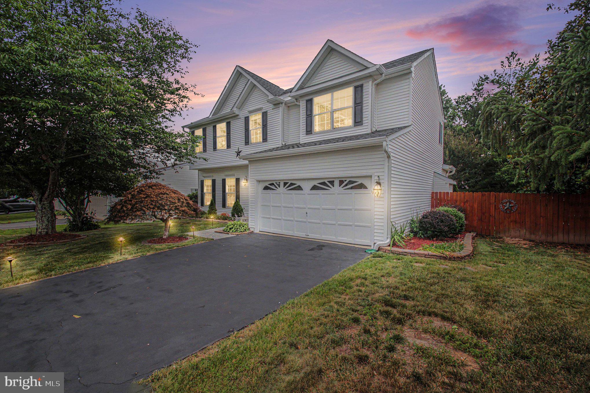 Welcome to 9224 Cynthia Street, a beautifully updated Colonial home in the highly desirable Blooms Crossing community of Manassas Park. This spacious residence offers approximately 2,970 square feet of living space with 4 bedrooms, 2 full bathrooms, and 2 half bathrooms. The home features fresh paint, updated flooring, new carpet, refreshed bathrooms, and numerous recent improvements, making it truly move-in ready. Enjoy a bright and functional floor plan with generous living and dining areas, a spacious kitchen, and a comfortable family room with a fireplace. The fully finished lower level provides additional living and entertaining space. Outside, you'll find extensive hardscape landscaping, a fenced backyard, deck, and patio—perfect for outdoor gatherings and relaxation. A two-car attached garage and ample driveway parking add convenience. Ideally located just minutes from the VRE, Signal Hill Park, shopping, dining, and major commuter routes. Don't miss this exceptional opportunity to own a beautifully maintained home in a prime location. Schedule your private tour today!
