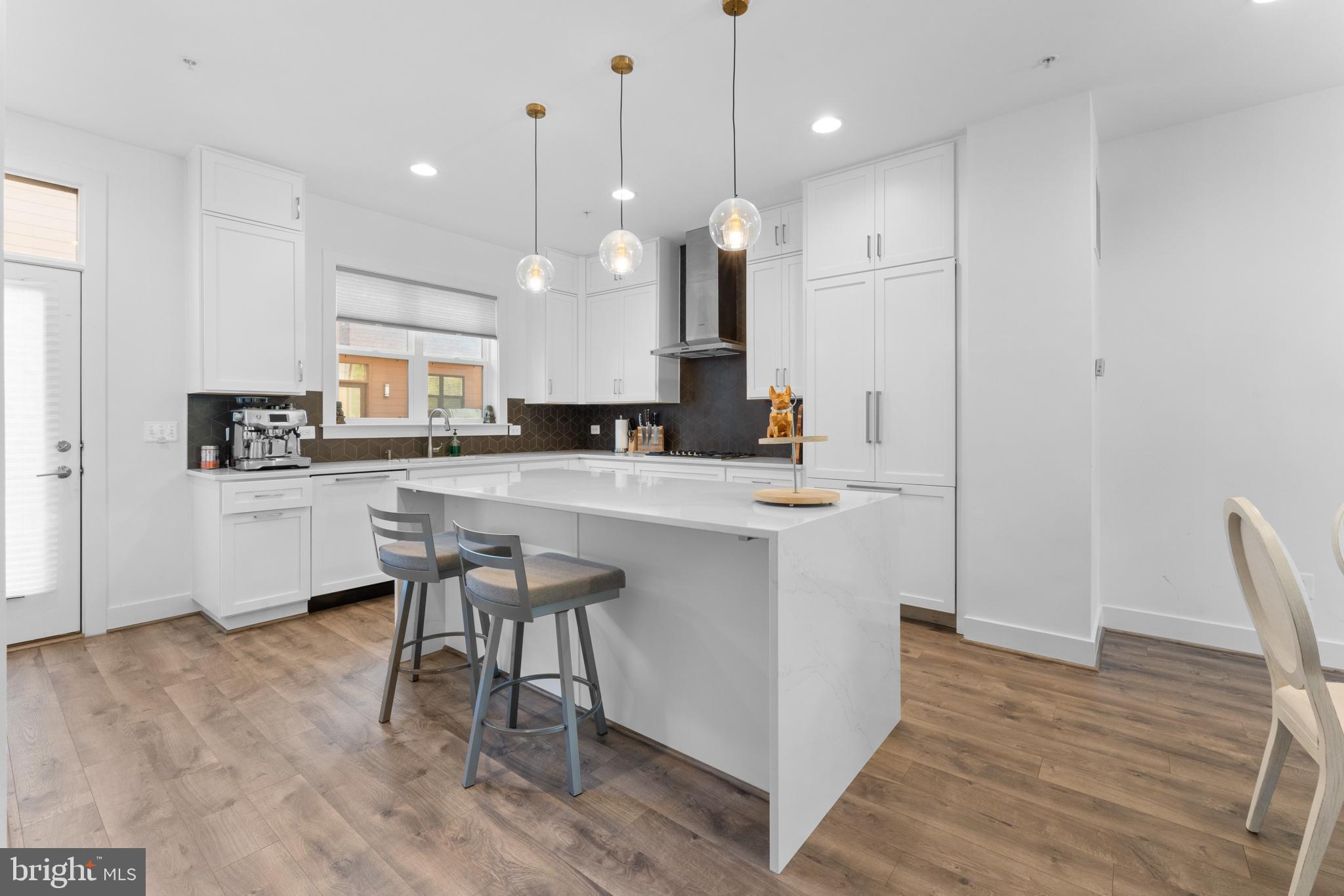 Price improved! This BAILEY model at the Reserve at Tower Oaks is only 4 years old, and is a top-tier show room with lots of upgrades at built. It has wood flooring throughout the property. The first floor was upgraded into a bedroom with full bath. It can also be used as an office, or your guest room which is on the same level with the garage.  The main floor upstairs has an open floor plan with big windows, eat-in kitchen island, waterfall kitchen island, white cabinets with some appliances hidden inside to have the minimal and modern look. Kitchen is equipped with stainless steel appiances and vented hood to improve ventilation. On the upper level, there are the ensuite primary bedroom, and two other bedrooms with closets. Washer and dryer set are conveniently located on this level. If you continue walking up through a private door onto the 4th floor, you will find the loft area connected to a walk-out rooftop terrace with a water hose convenient for watering your plants. This floor also had a bedroom with ensuite full bathroom. This house doesn't have an elevator. Tower Oaks was voted by Bethesda Magazine as the "Best Townhome Community of 2022"! The center of the Community is the CORE, a lifestyle and recreation center. The community building CORE, featuring state-of -the-art fitness center, yoga room, Amazon Hub,  resident lounge, activity room, club room, outdoor pool with lounge areas, barbeque grills, firepits, tot lot, pickleball/basketball courts, with scheduled events. The property is conveniently location on the Parkway in the Tower Oaks area, close to I-270 and I-495, shopping centers and restaurants such as Founding Farmers, Clyde's, Pike & Rose, and Park Potomac.