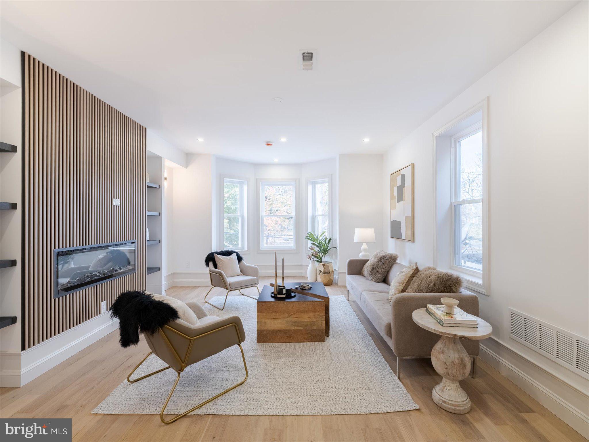 A METICULOUSLY RENOVATED DUPLEX in the best part of West Philadelphia right on the Malcolm X park. 413 S 51st Street is a legal duplex that has been thoughtfully redesigned, featuring all new mechanicals, brand new electrical systems, and high-end finishes that perfectly blend historic character with contemporary comfort. 

The larger owner's unit spans three impressive levels, offering 5 BEDROOMS and 3.5 BATH UNIT of refined living space. 
First Floor: Step through the inviting entry into a warm and sophisticated library/home office/guest bedroom, complete with a stylish half bath and framed by the home’s beautiful original staircase—a striking nod to its historic roots. 
Second Floor: An elegant living room overlooks the park, featuring a custom-built TV wall with shelving and a modern fireplace, creating a perfect gathering space. The breathtaking kitchen is a true showpiece—equipped with top-of-the-line appliances, a large waterfall island with deep sink, and an adjoining drink bar with wine fridge. A guest suite or study with an en suite bath, plus a laundry area and pantry space, complete this level with both beauty and practicality. 
Third Floor: The primary suite offers peaceful park views and a spa-inspired primary bathroom with double sinks, a soaking tub, and a separate glass shower. Two additional bedrooms and a full hall bathroom provide generous space for family or guests. Every detail of this house has been carefully designed for comfort, functionality, and style. 

The rear portion of the first floor hosts a charming LARGE 1 BED 1 BATH APARTMENT, fully renovated with all new appliances, modern finishes, and its own laundry and home office area. With a separate electric meter, this unit offers privacy and independence—ideal for tenants or extended family. The potential rental income can significantly offset your mortgage, adding exceptional value to this remarkable property. 

From the high-end craftsmanship inside to the refreshed exterior curb appeal, this home delivers modern luxury in one of Philadelphia’s most sought-after neighborhoods—just moments from Clark Park, UPenn, and the city’s best dining and cafes.