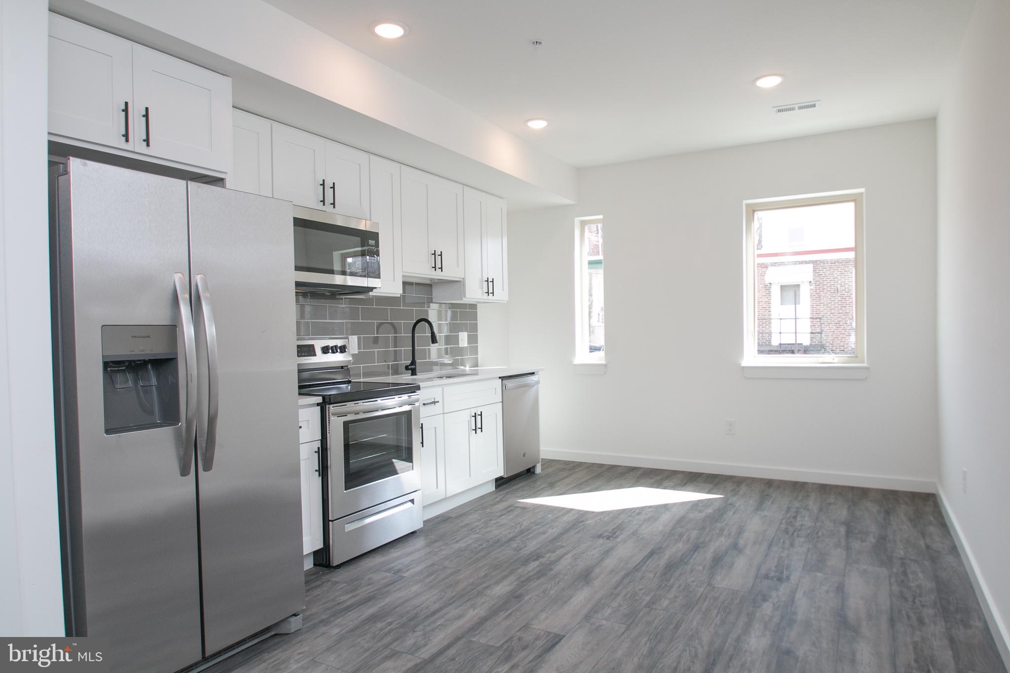 New construction and ready for immediate move-in. Building is located directly off 50th & Market. This unit features top-tier modern finishes, which include MSI quartz countertops, stainless steel appliances (microwave, oven, hood-vent, fridge, dishwasher), stacked in-unit washer/dryer, hardwood flooring,  walk-out balcony and so much more. Do not hesitate and schedule a tour today before this unit is gone.