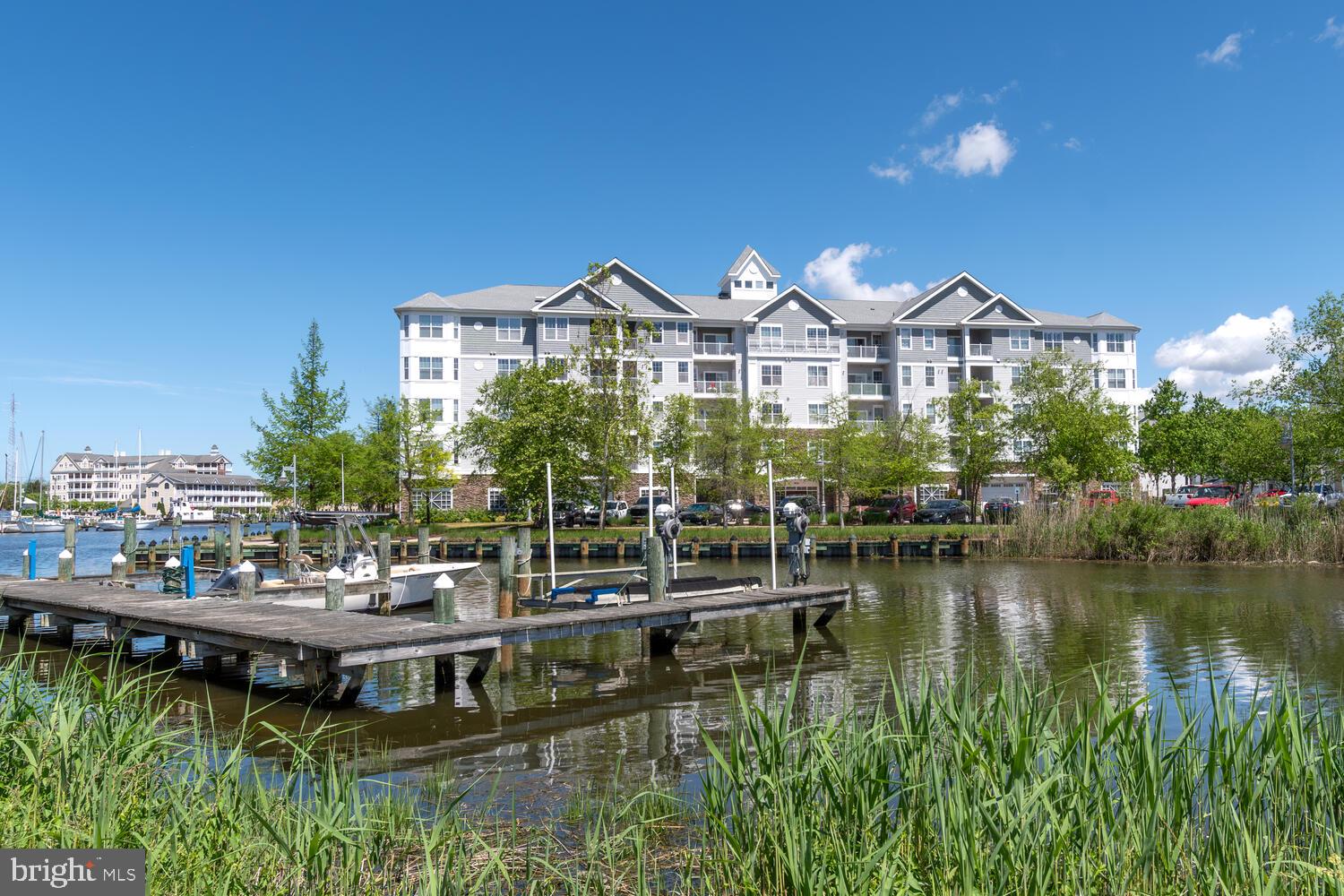 This cozy 2 bedroom, 2 bath condo is nestled in the sought-after waterside community of Deep Harbour. As you enter, you'll be greeted by a bright and spacious living area that flows seamlessly into the kitchen, equipped with modern appliances, sleek countertops, and ample cabinet space. The primary features a private en-suite bath and plenty of closet space, while the second bedroom offers versatility for guests or a home office. Outside, enjoy a private balcony with creek views, or take a stroll along the public riverwalk that outlines the community, with downtown restaurants and shopping just minutes away. Deep Harbour is a gated community with secure assigned garage parking, keypad/fob front building entry, and nearby boat ramps. Enjoy access to a community pool, nearby parks, playgrounds, the Fishing Pier, and the Harriet Tubman Museum & Educational Center in Cambridge. Nature lovers will appreciate the nearby Blackwater National Wildlife Refuge and its Visitor Center. Storage unit included.