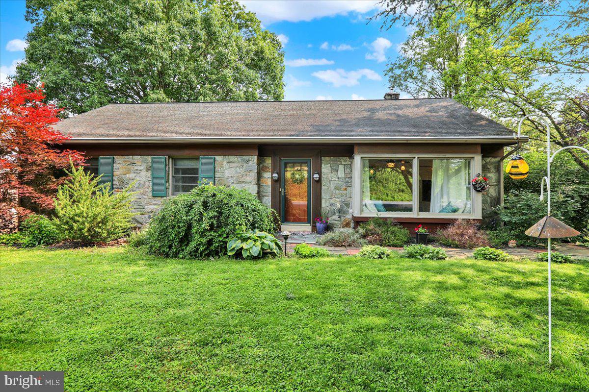 Showings by APPOINTMENT ONLY. Please respect the owners' privacy. Welcome home to this solid, meticulously maintained cape-style ranch, perfectly poised on a private 3/4+ acre lot that gently leads to your own tranquil slice of the Little Conestoga Creek. Imagine relaxing on the expansive rear deck, overlooking a peaceful, wooded backdrop. Inside, you’ll find a perfect blend of mid-century charm and modern updates, bathed in natural light from oversized windows. The inviting living room features a striking, floor-to-ceiling white stone propane fireplace. Flow effortlessly into the crisp, clean kitchen—complete with 30-handle white cabinets—which opens beautifully to a spacious dining area. Main Level Living: Offers three comfortable bedrooms, an oversized full bath, and a convenient first-floor laundry. Upper Level: Features a massive bonus room spanning most of the upper floor, perfect as a private primary suite or fourth bedroom, it also has an additional storage area. Lower Level & Exterior: A lower-level mudroom leads to a second full bath and a versatile family room/den. Car enthusiasts and hobbyists will love the oversized 32' x 25' garage space. Just minutes from Millersville, this property offers the ultimate country escape with suburban convenience! Seller has found a new home and is Motivated!