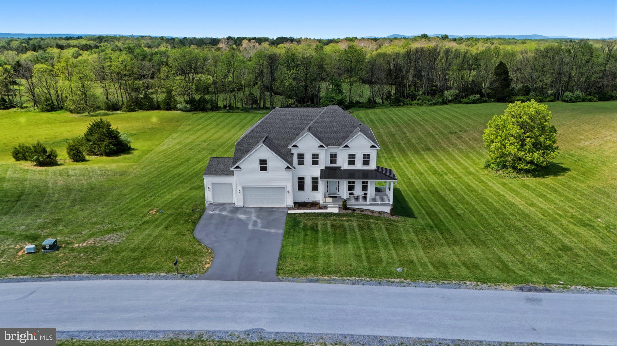 Stunning luxury living in the scenic countryside of highly desired Stone Mill Estates — situated on 2 beautiful acres backing to trees for the perfect blend of privacy and elegance! This impressive floor plan offers 4 bedrooms, 3.5 baths, a whole house reverse osmosis system, two hot water tanks, an unfinished basement, and a rare three-car garage with professionally epoxied floors and painted walls for a polished finish that car enthusiasts and hobbyists will appreciate! 

Inside, the dramatic two-story family room creates a stunning focal point filled with natural light and soaring ceilings. The oversized gourmet kitchen is designed for gathering and entertaining with an abundance of cabinetry, quartz countertops, a massive center island, walk-in pantry, and stainless-steel appliances.

The luxurious primary suite features a tray ceiling, spacious walk-in closet, and spa-inspired bath complete with a soaking tub and oversized walk-in shower. All guest bedrooms are generously sized with walk-in closets, while Bedroom 2 enjoys its own private en-suite bath. Bedrooms 3 and 4 are connected by a convenient Jack-and-Jill bathroom layout.

The unfinished basement already includes a 3-piece rough-in, giving you endless possibilities to create the perfect extension of your home — whether you envision a home gym, theater room, guest suite, playroom, man cave, or all of the above. And with the amount of space this home offers, storage will never be an issue. The exterior of the home was upgraded with Fortress Foundations LawnScapes around the home.